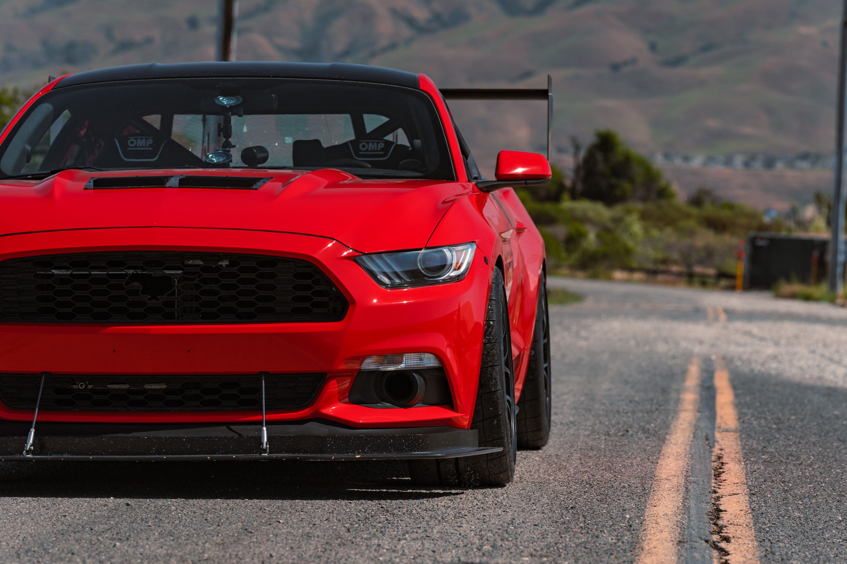 Red Ford S550 Mustang GT with 19" EC-7 Apex wheels in Satin Black