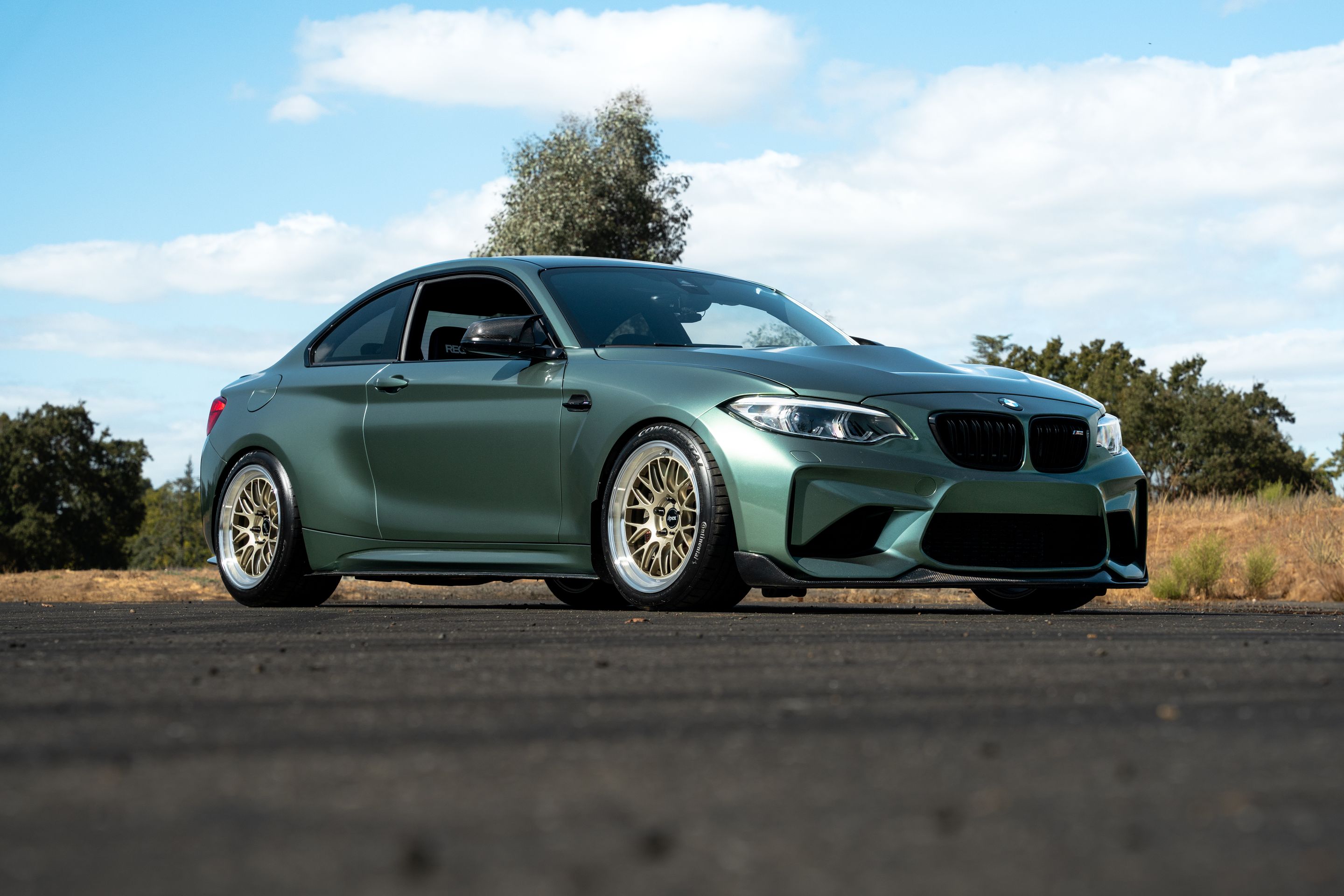 Green BMW F87 M2 with 18" ML-10RT Apex wheels in Machined Lip Gloss Motorsport Gold