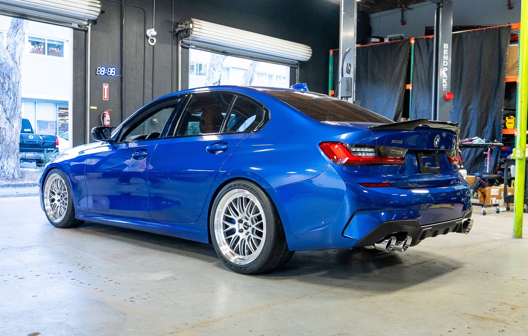 Blue BMW G20 Sedan 3 Series with 19" ML-10RT Apex wheels in Machined Lip Race Silver