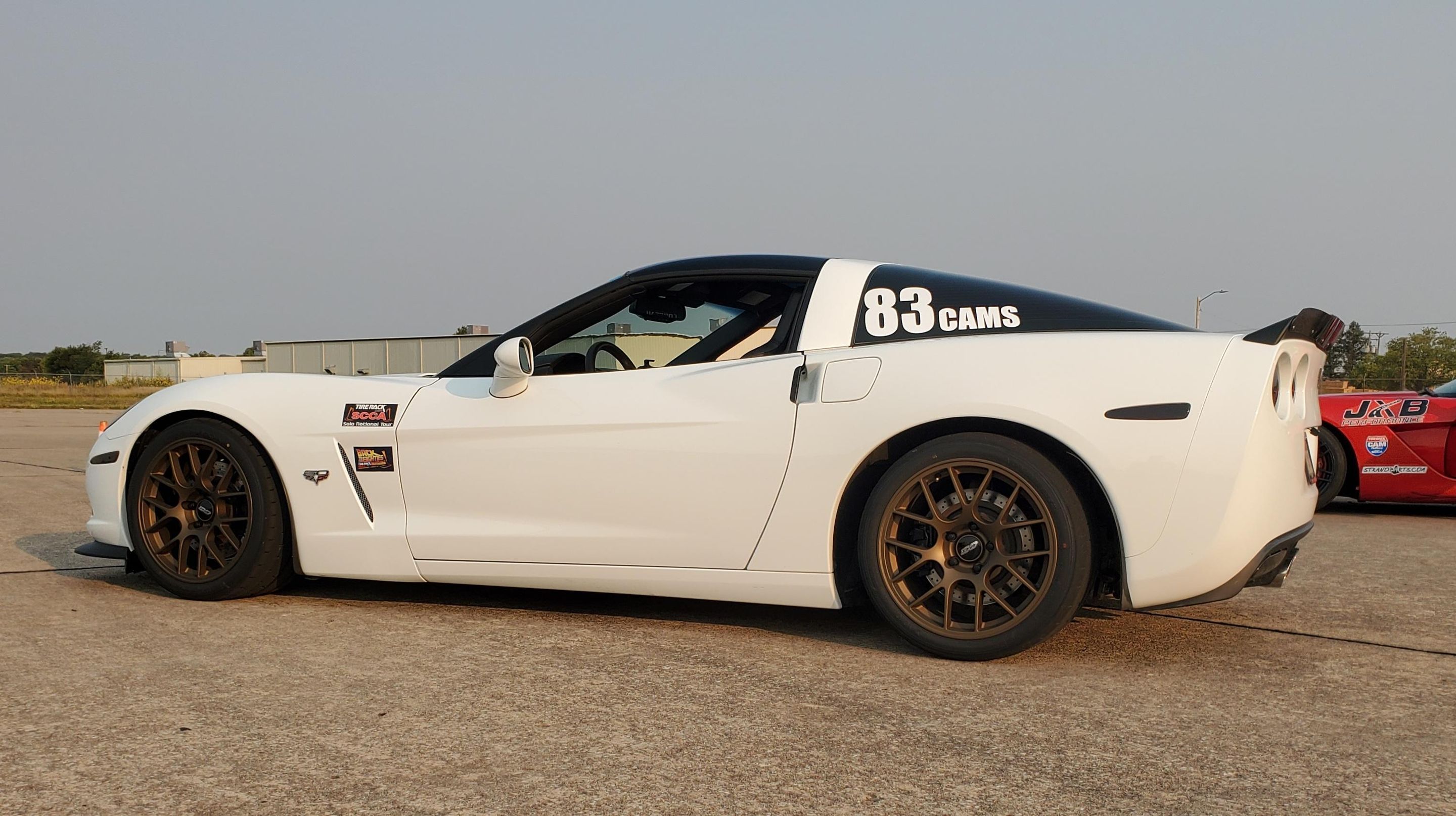White Chevrolet C6 Corvette Base/Z51 with 18" EC-7 Apex wheels in Satin Bronze