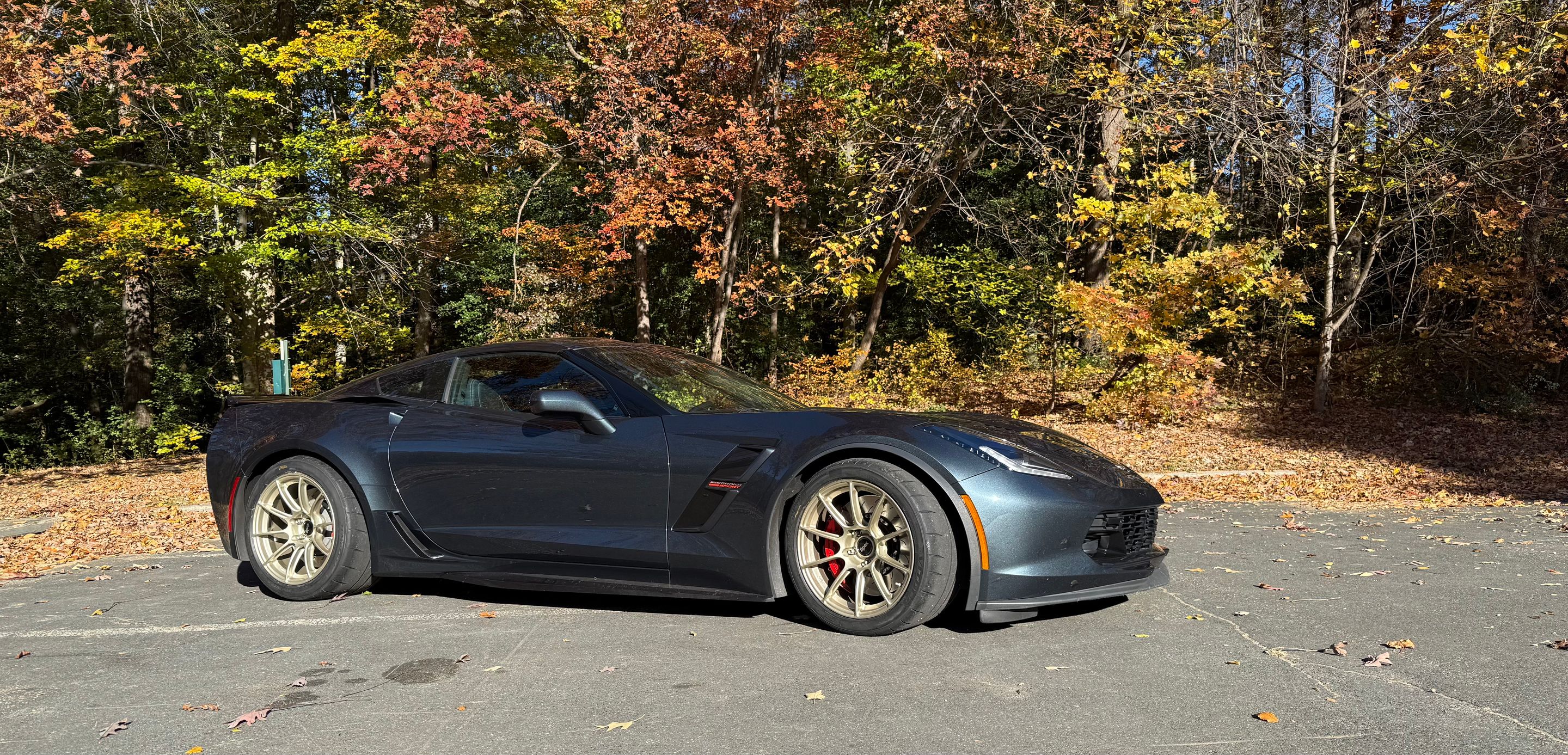Grey Chevrolet C7 Corvette Grand Sport with 18" SM-10RS Apex wheels in Motorsport Gold