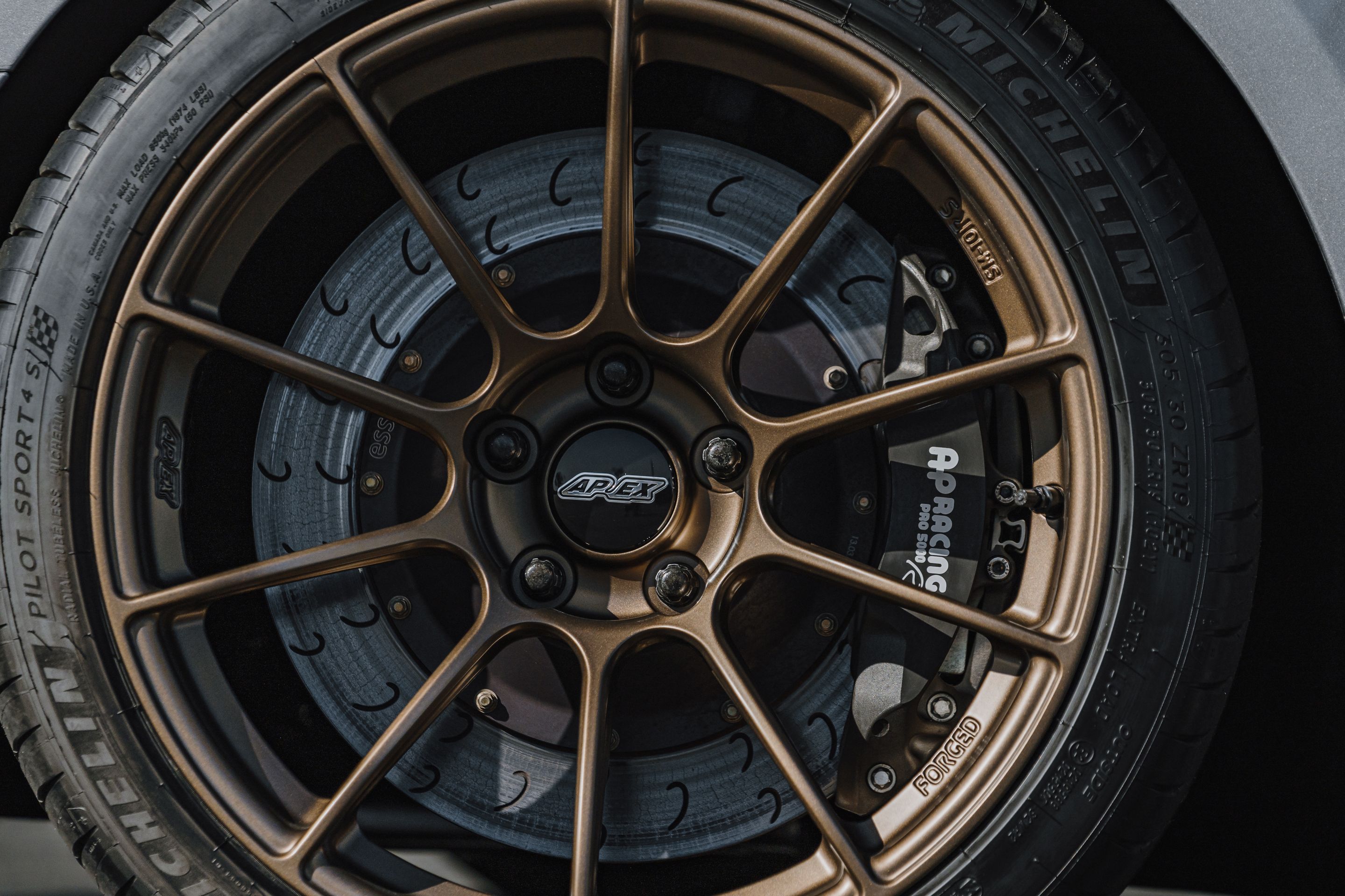 Silver Chevrolet 6th Gen Camaro ZL1 1LE with 19" SM-10RS Apex wheels in Satin Bronze