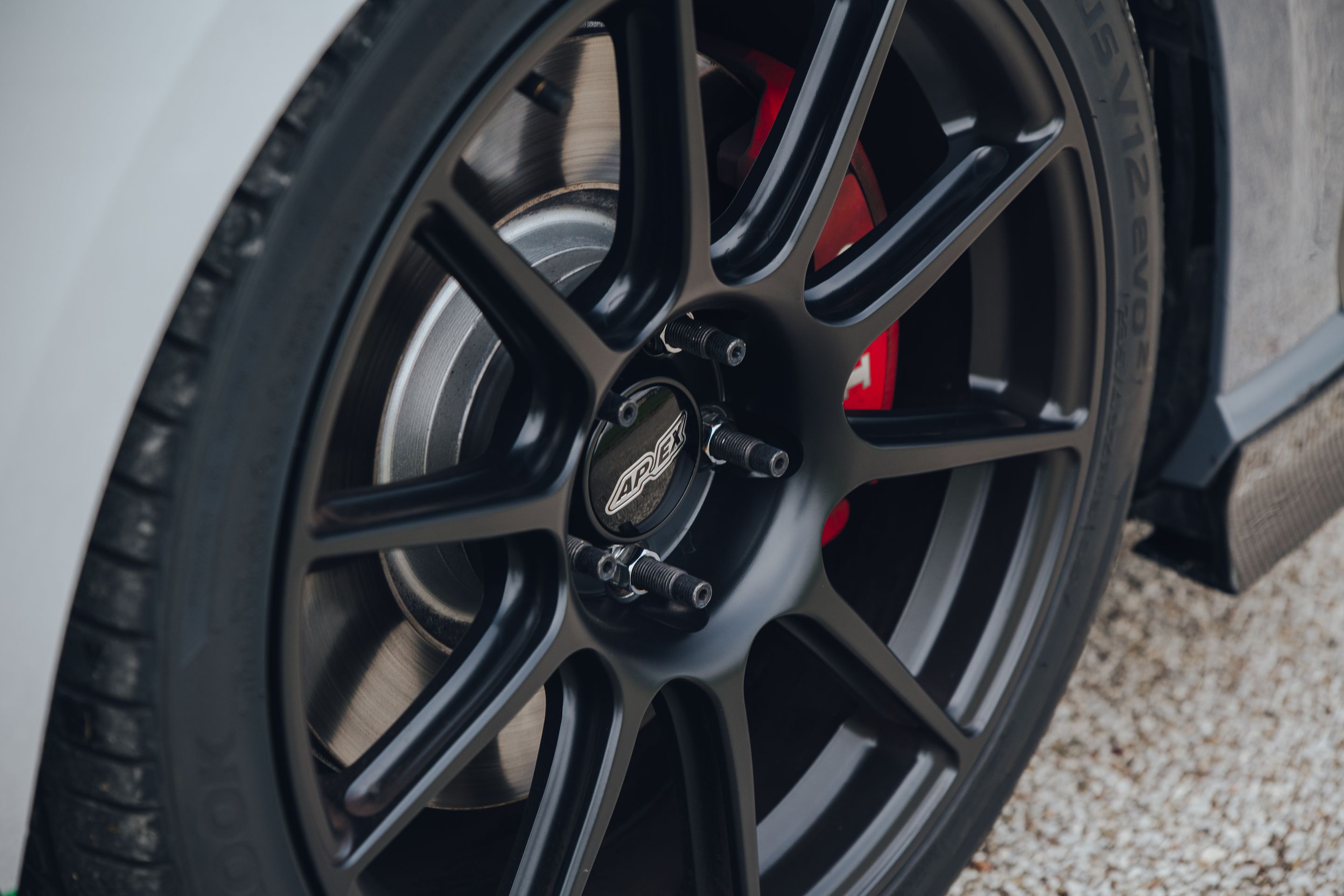 Race Livery VW MK7 GTI with 18" SM-10 Apex wheels in Satin Black