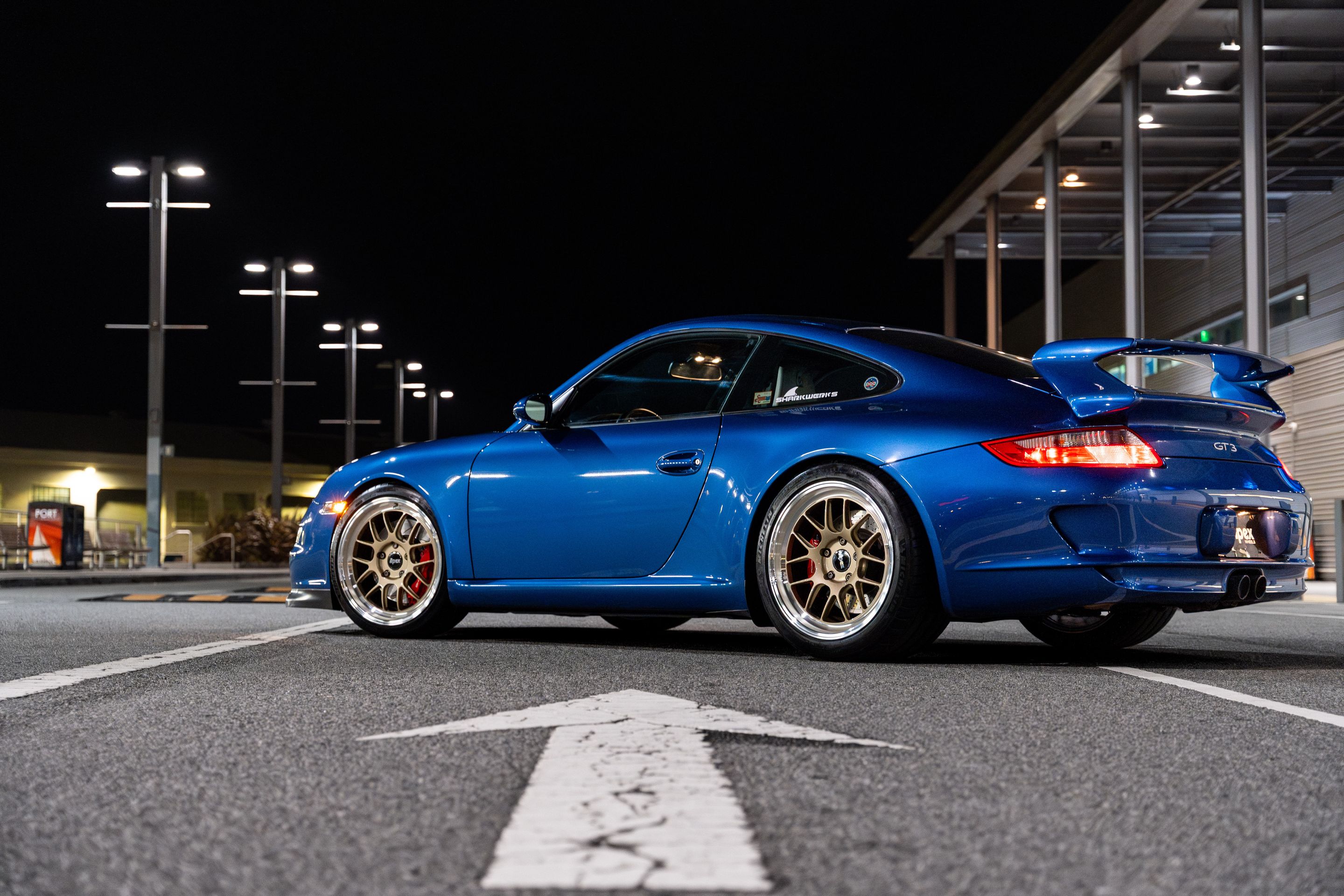 Blue Porsche 911 997 GT3 with 19" TEST-M Apex wheels in Machined Lip Gloss Motorsport Gold