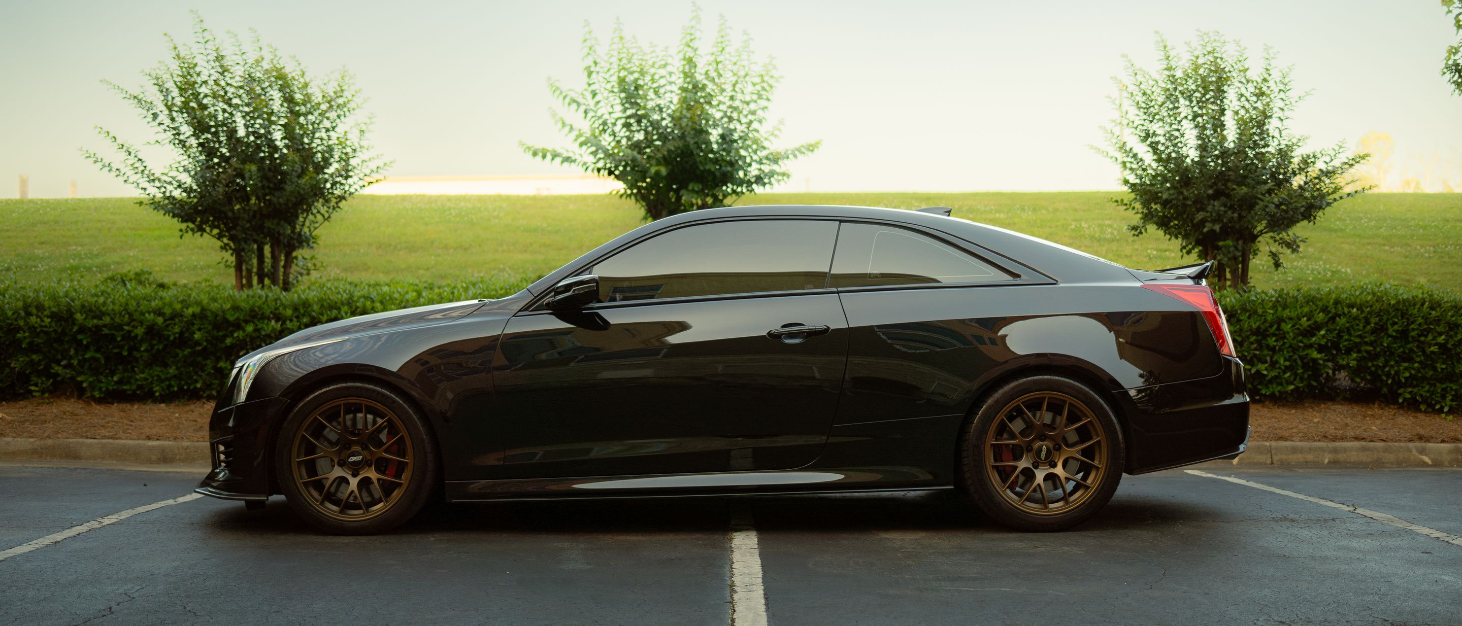 Black Cadillac ATS-V with 18" EC-7 Apex wheels in Satin Bronze