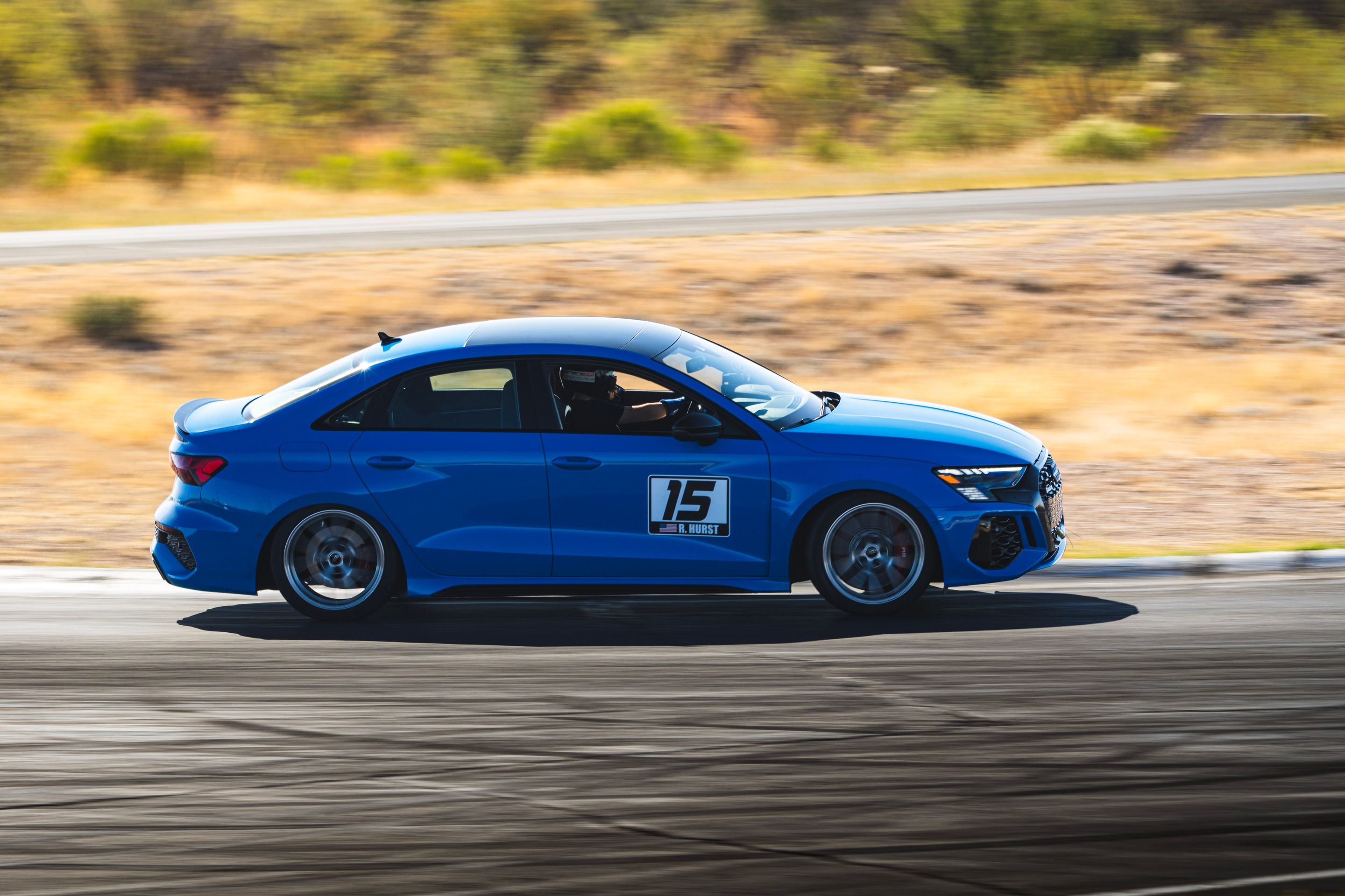 Blue Audi 8Y RS 3 with 18" VS-5RS Apex wheels in Brushed Clear