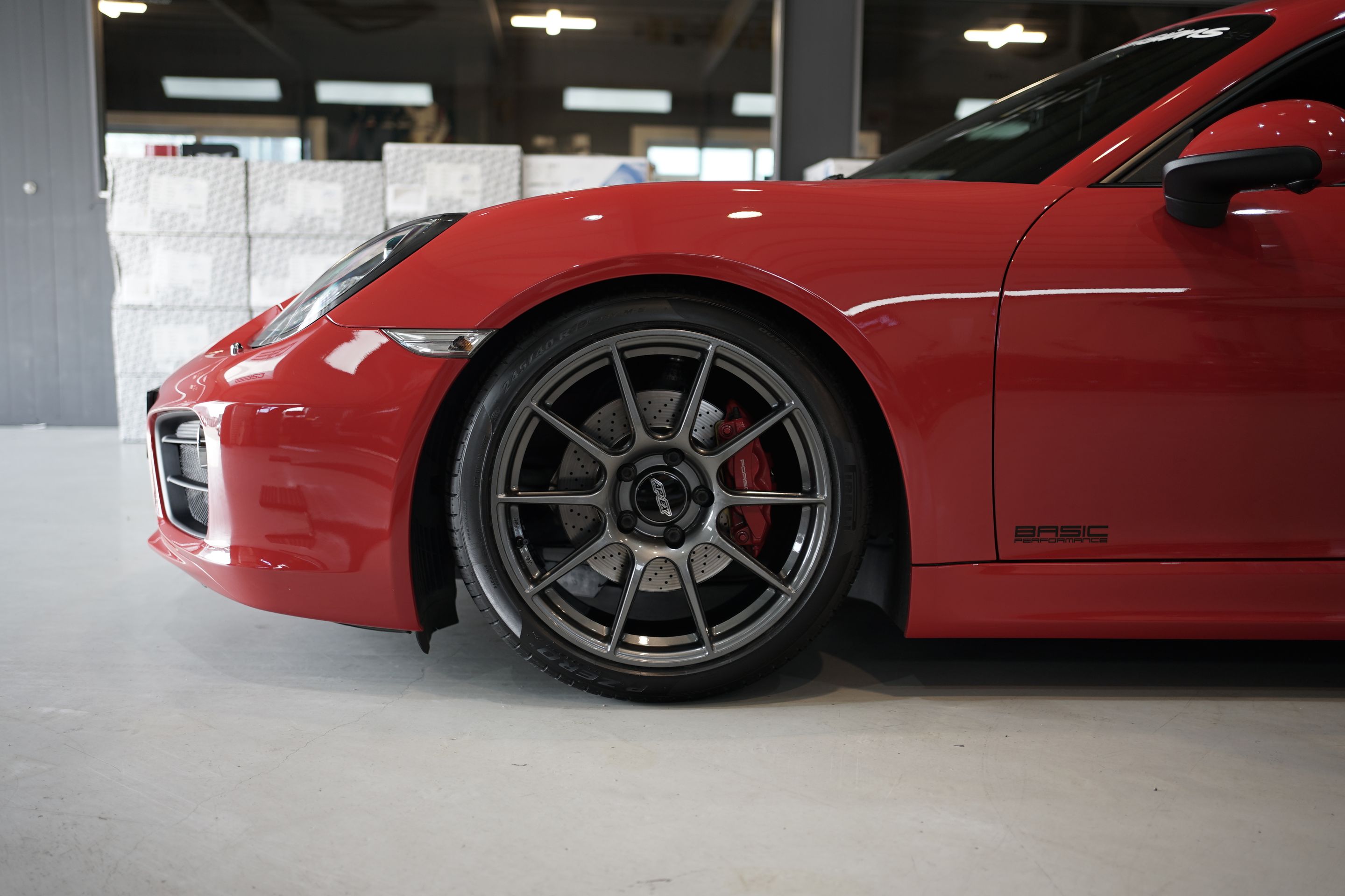 Red Porsche 981 Cayman S with 19" SM-10 Apex wheels in Anthracite