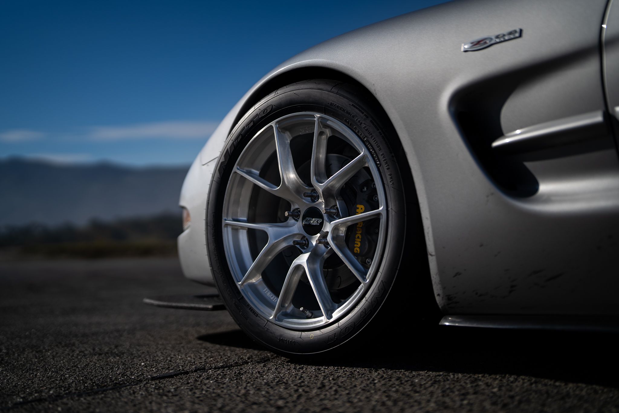 Silver Chevrolet C5 Corvette Z06 with 18" VS-5RS Apex wheels in Brushed Clear