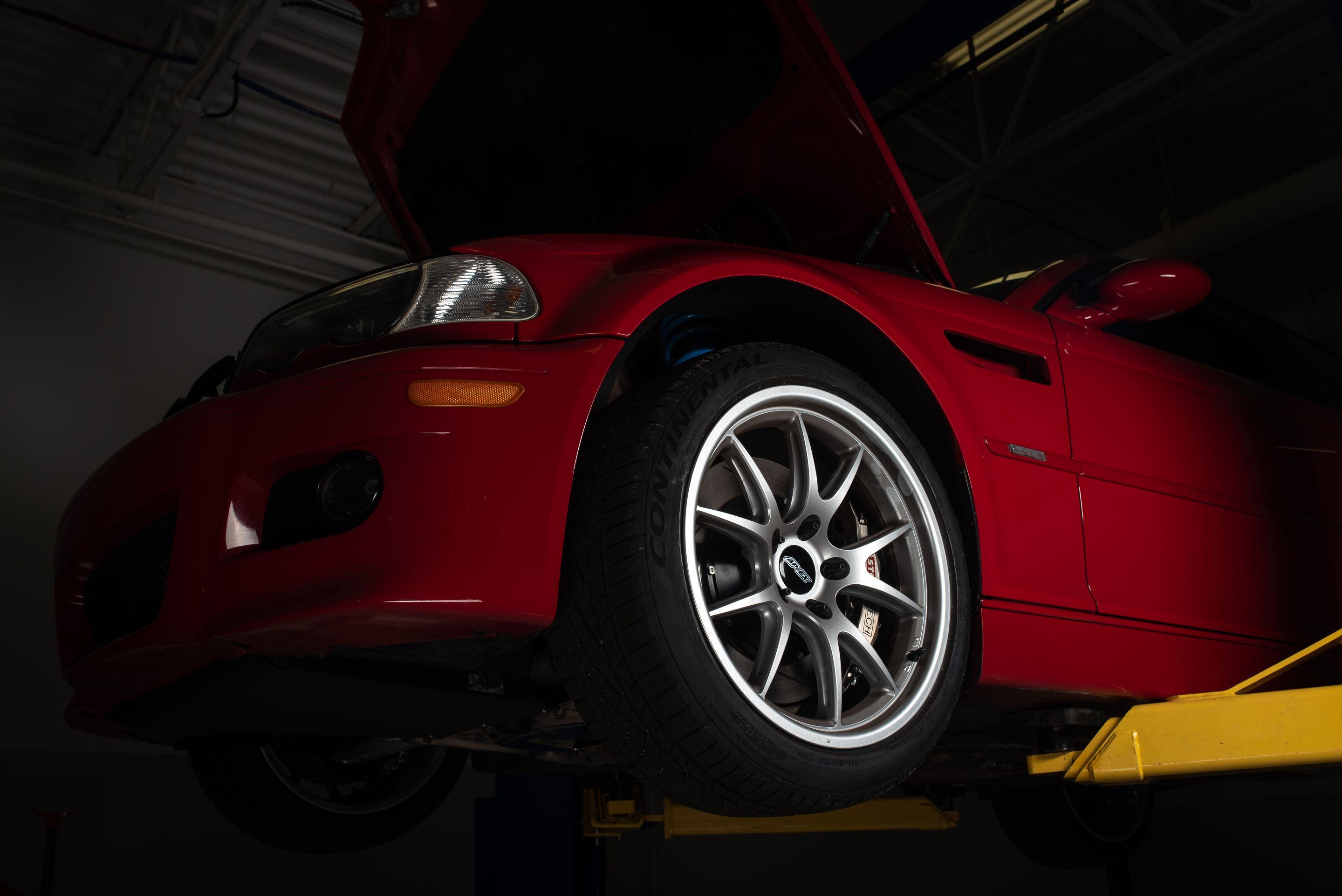 Red BMW E46 M3 with 18" FL-5 Apex wheels in Race Silver