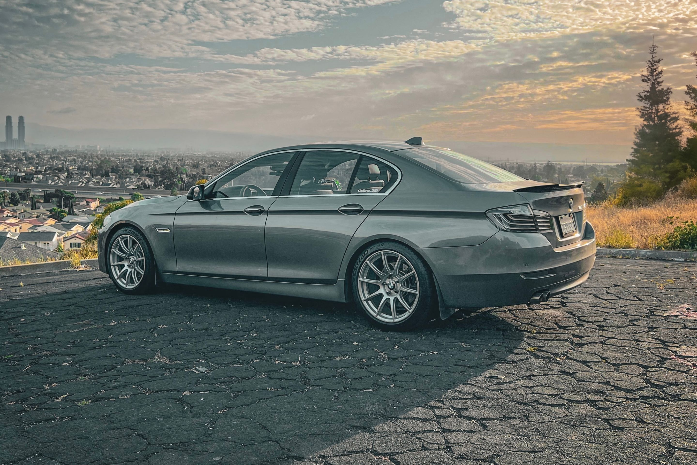 Grey BMW F10 Sedan 5 Series with 19" SM-10 Apex wheels in Race Silver