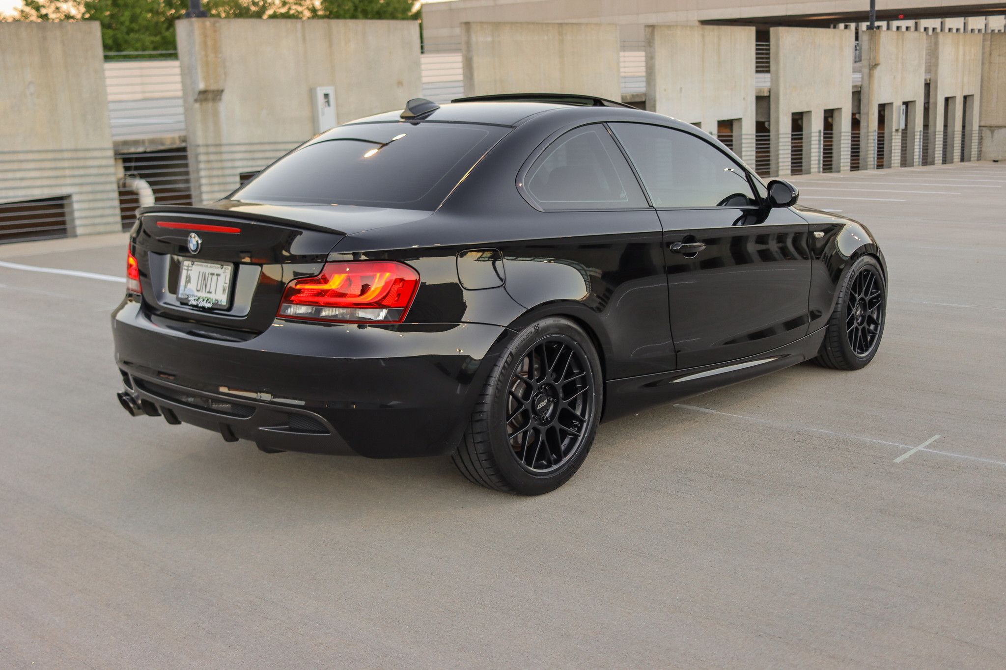 Black BMW E82 Coupe 1 Series with 18" ARC-8 Apex wheels in Satin Black