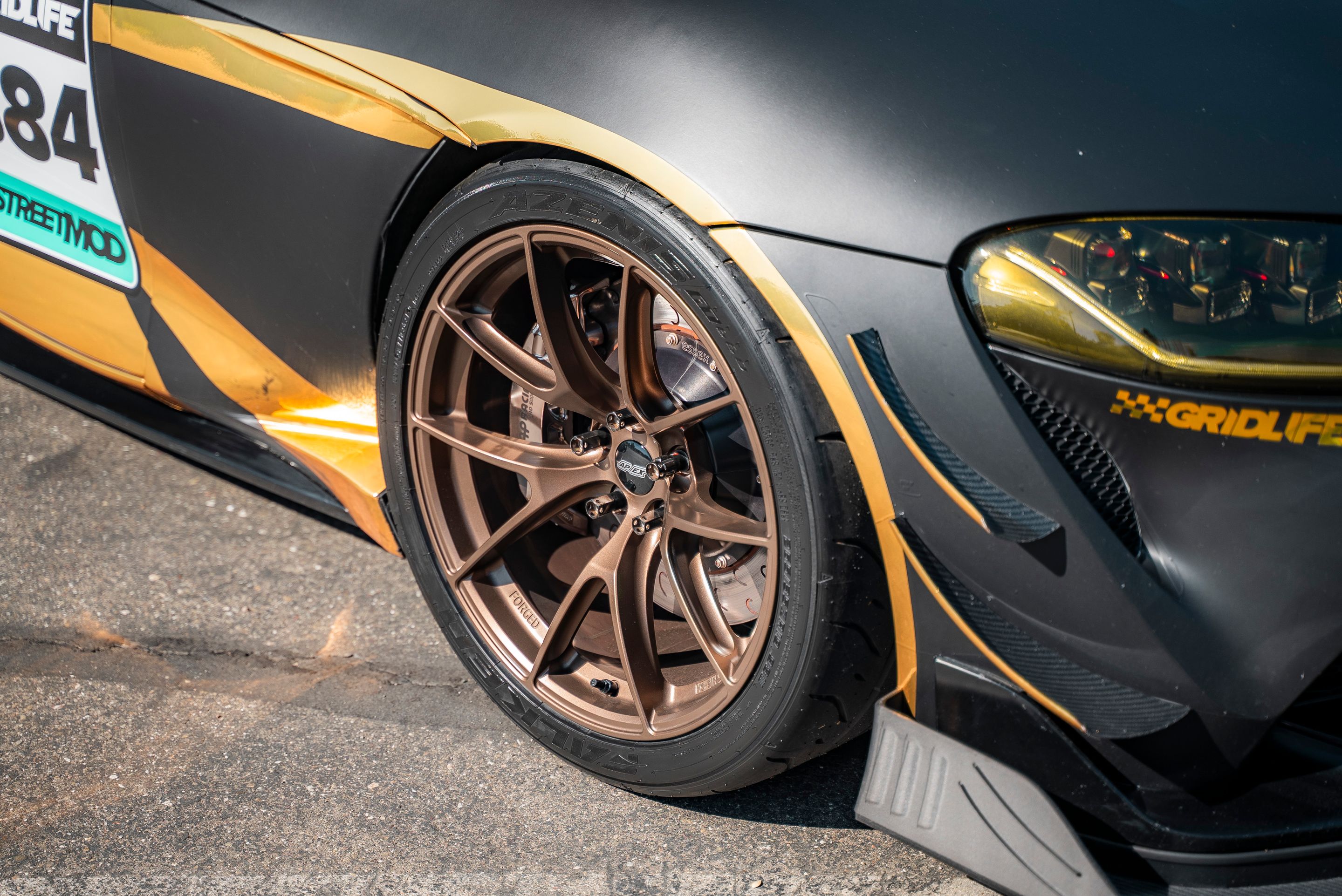 Grey Toyota GR Supra with 19" VS-5RS Apex wheels in Satin Bronze