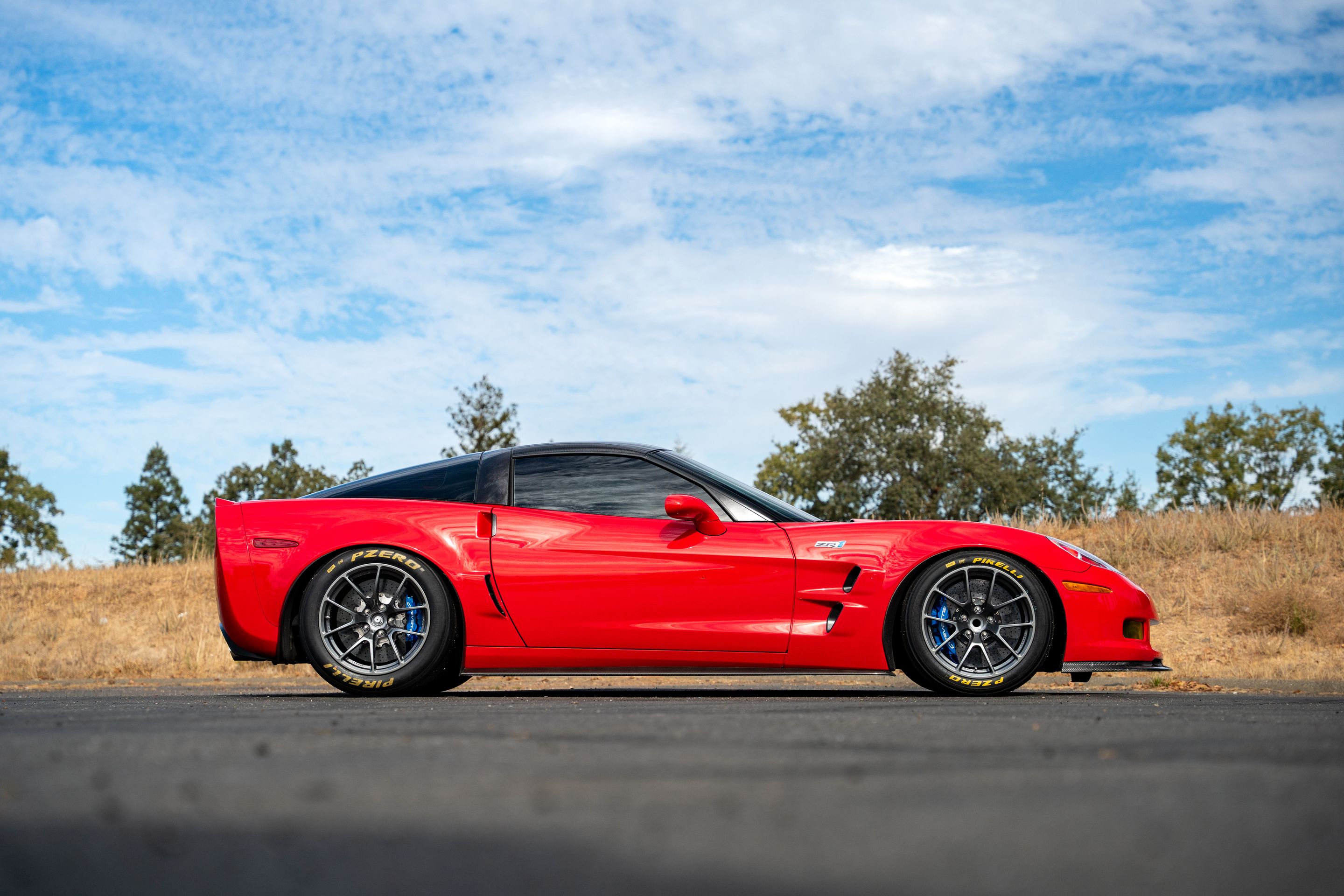 Red Chevrolet C6 Corvette ZR-1 with 18" VS-5RE Apex wheels in Anthracite