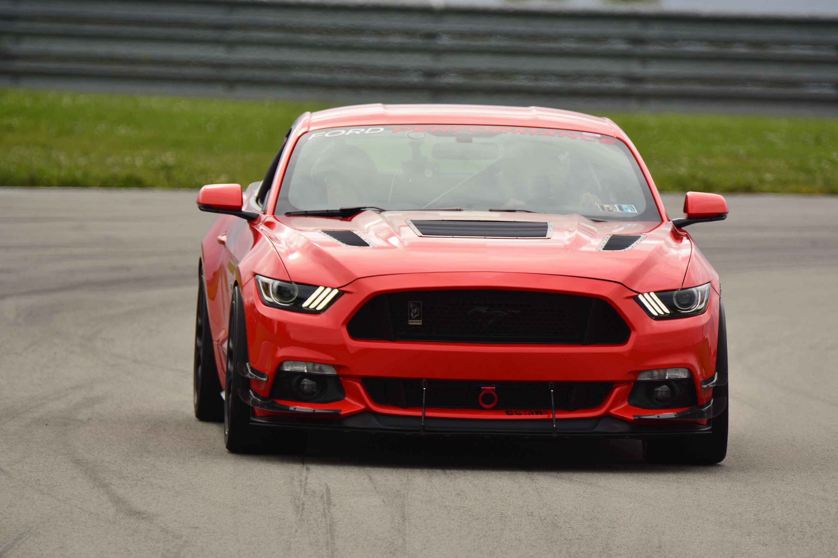 Orange Ford S550 Mustang GT with 19" EC-7 Apex wheels in Satin Black