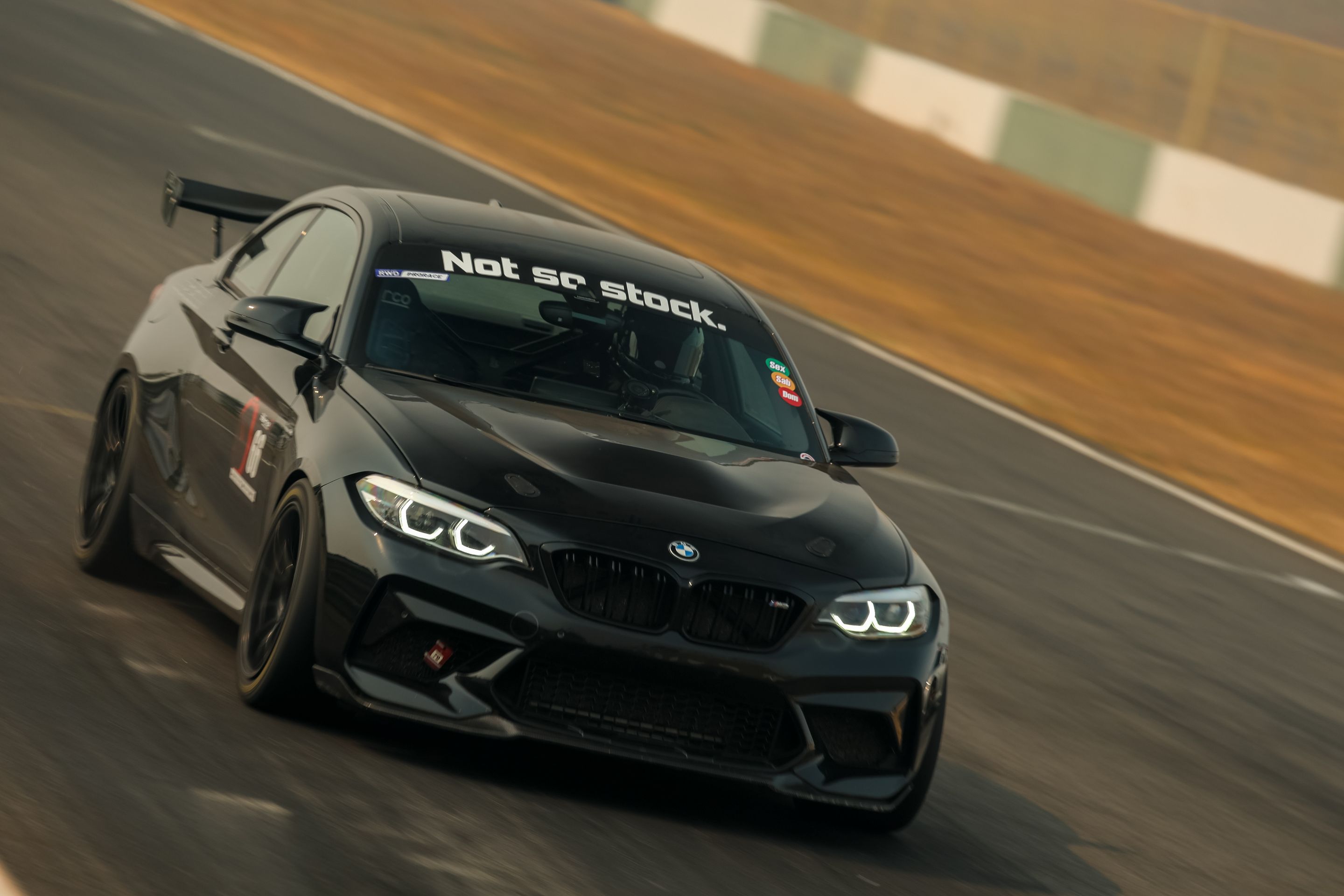 Black BMW F87 M2 with 18" SM-10RE Apex wheels in Anthracite