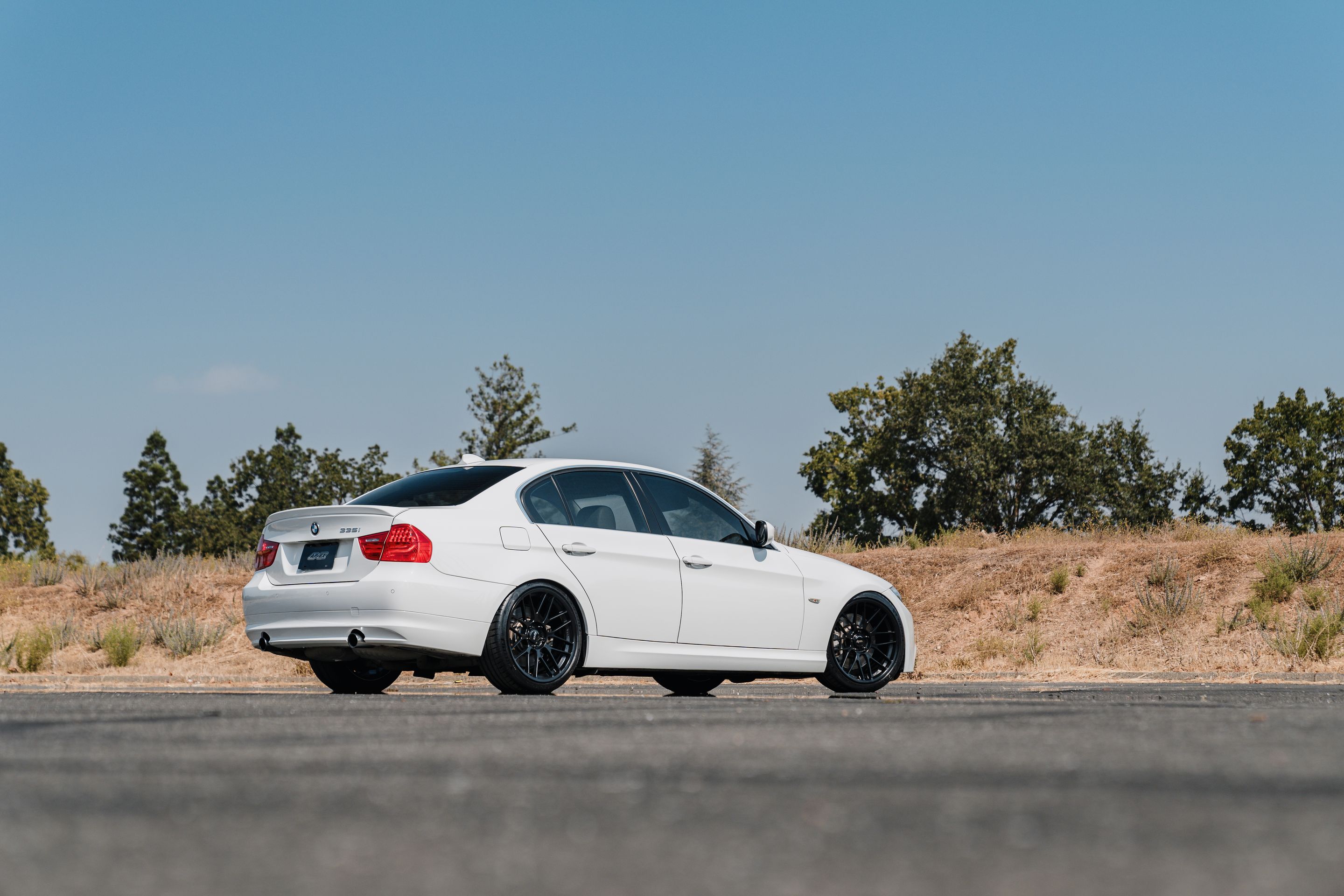 White BMW E90 LCI Sedan 3 Series with 19" ARC-8RT Apex wheels in Satin Black