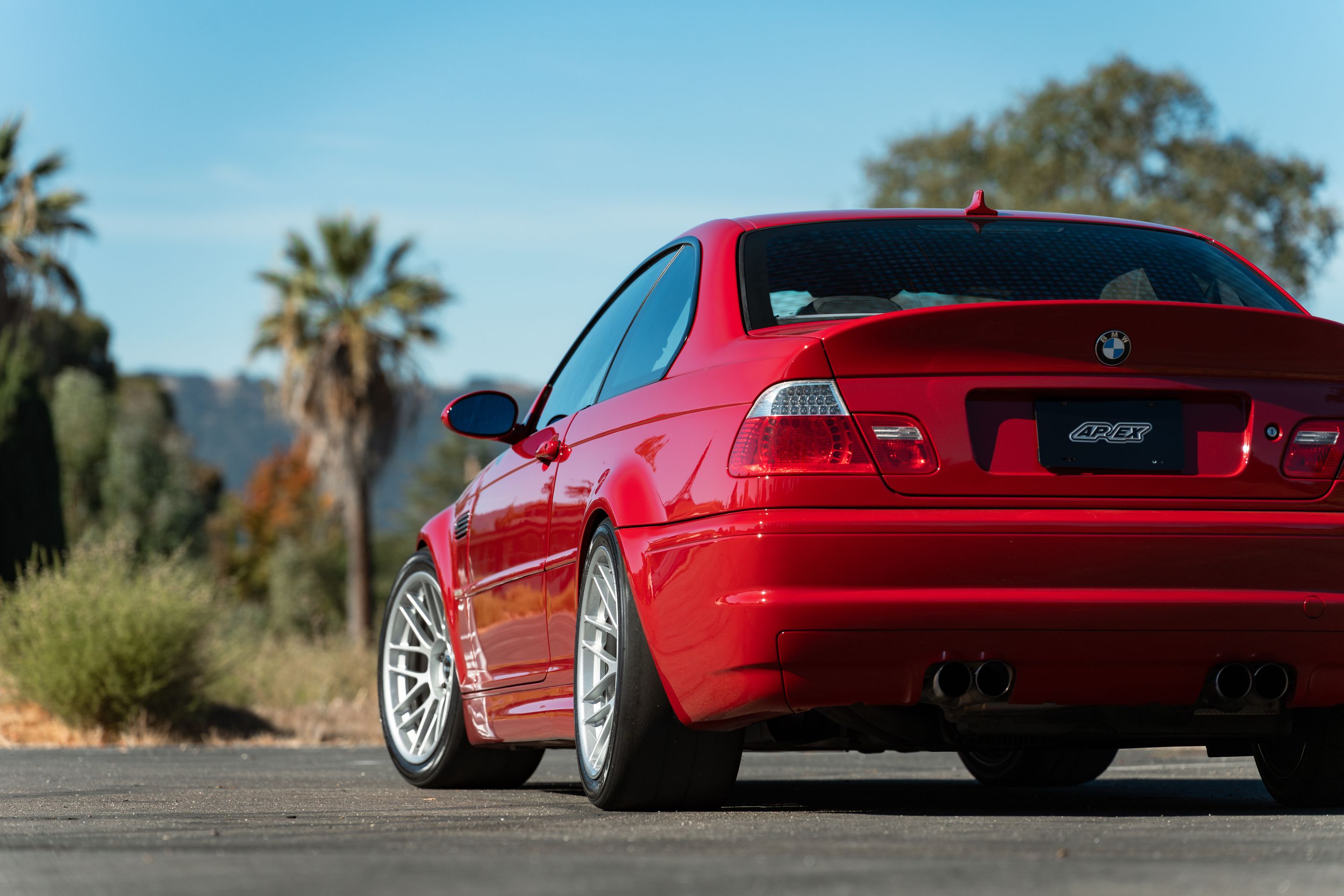 Red BMW E46 M3 with 18" ARC-8RT Apex wheels in Race Silver