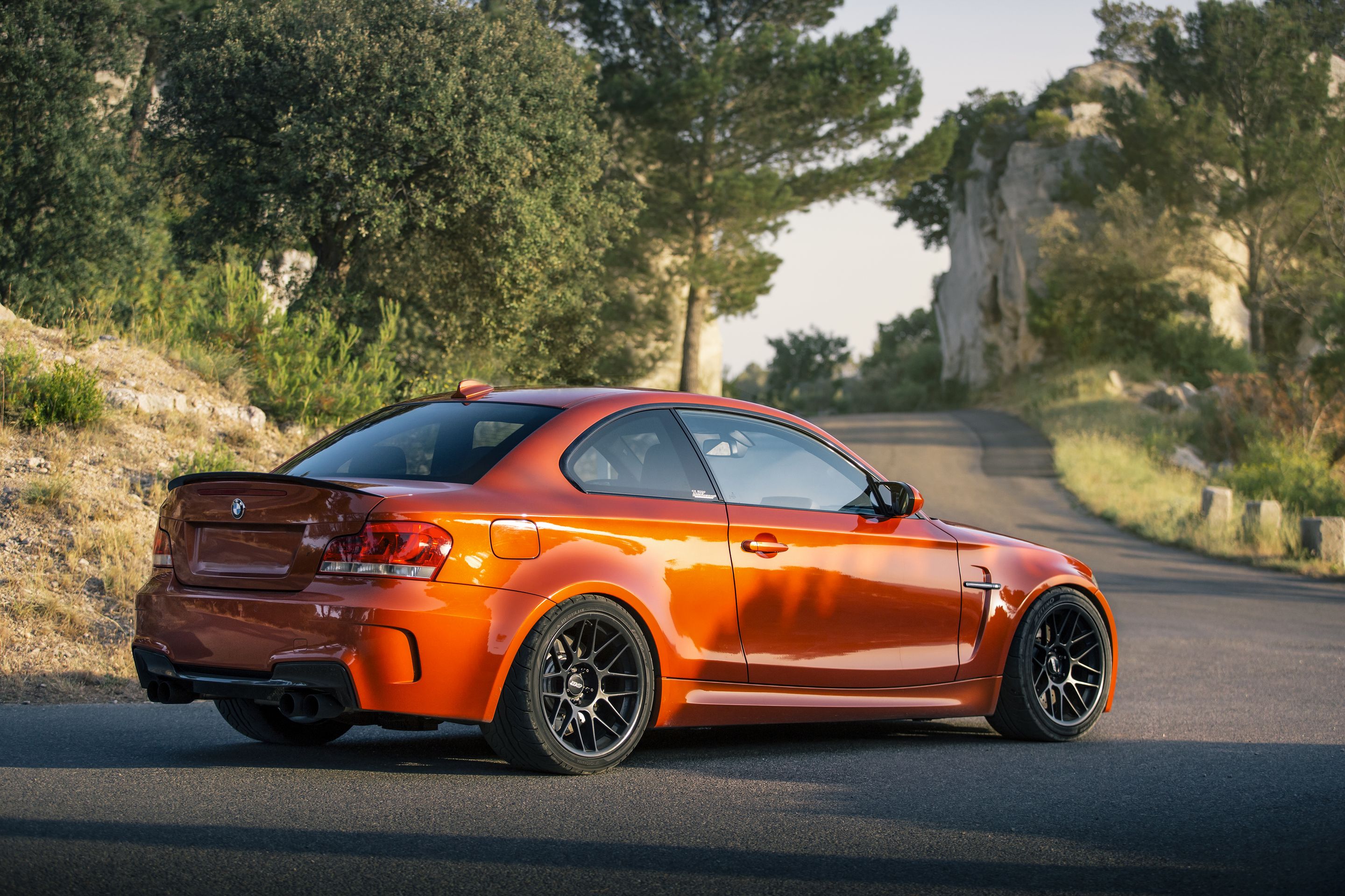 Orange BMW E82 1M with 18" ARC-8 Apex wheels in Satin Black