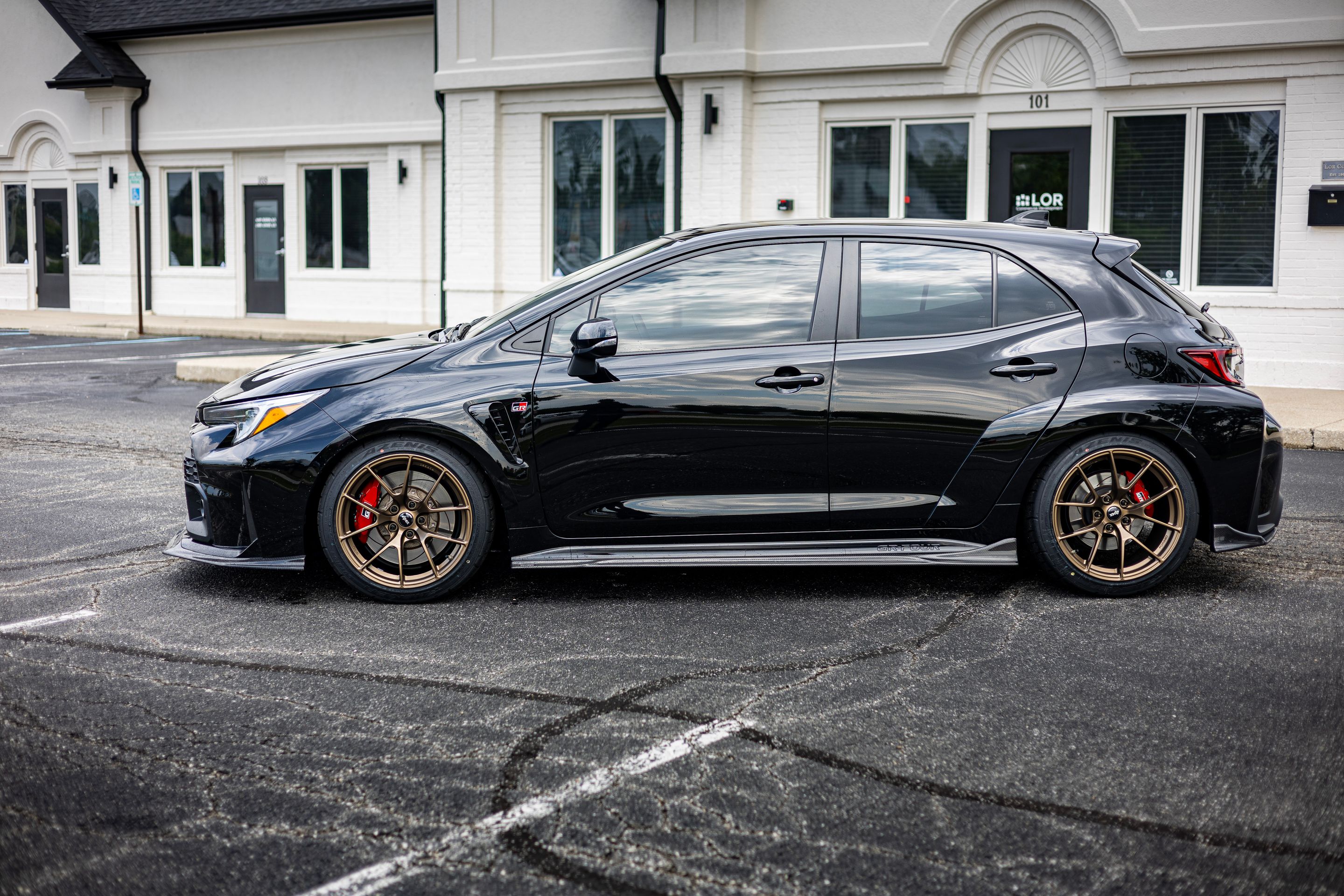Black Toyota GR Corolla with 18" VS-5RS Apex wheels in Satin Bronze