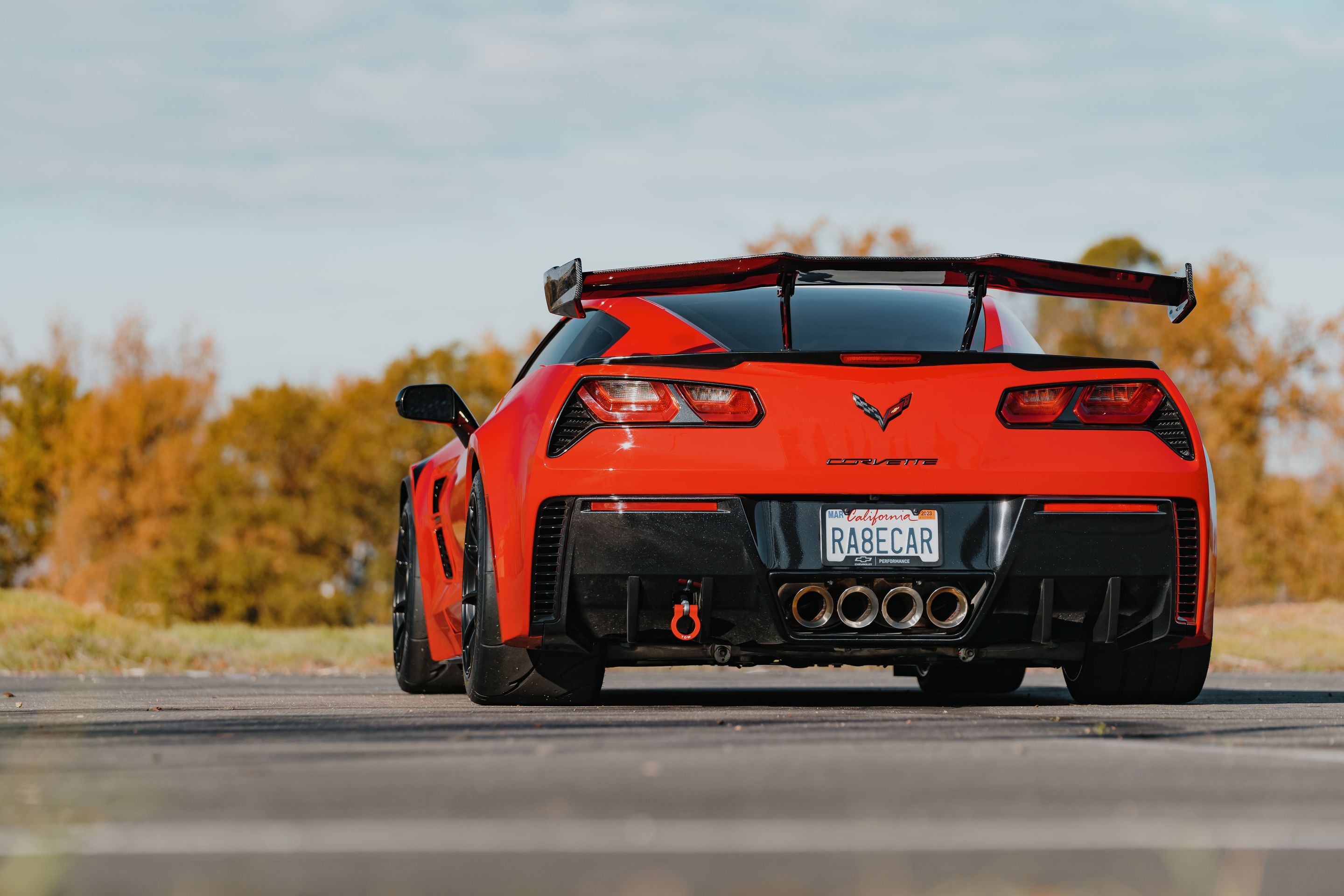 Red Chevrolet C7 Corvette Grand Sport with 18" SM-10RS Apex wheels in Satin Black
