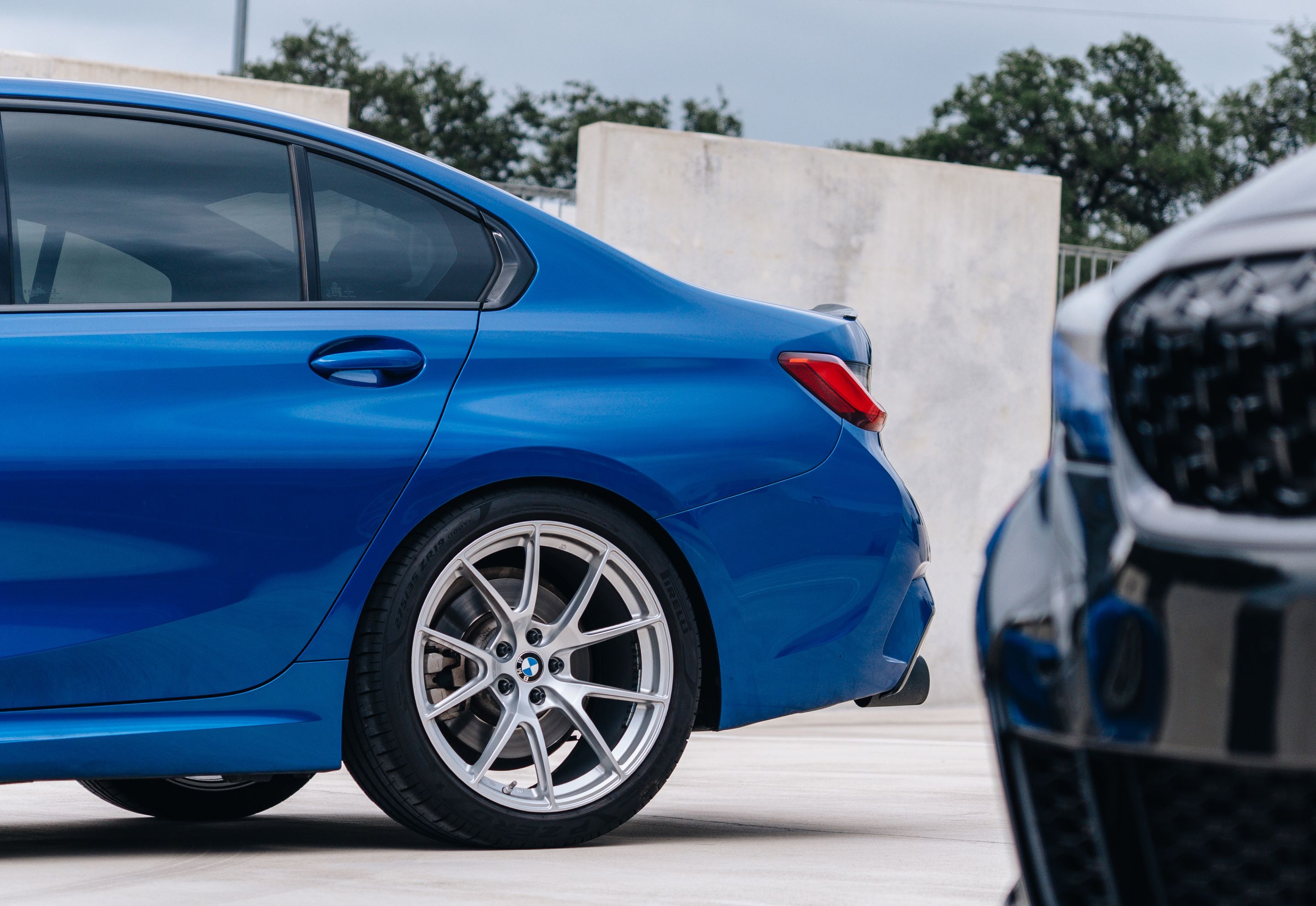 Blue BMW G20 Sedan 3 Series with 19" VS-5 Apex wheels in Race Silver