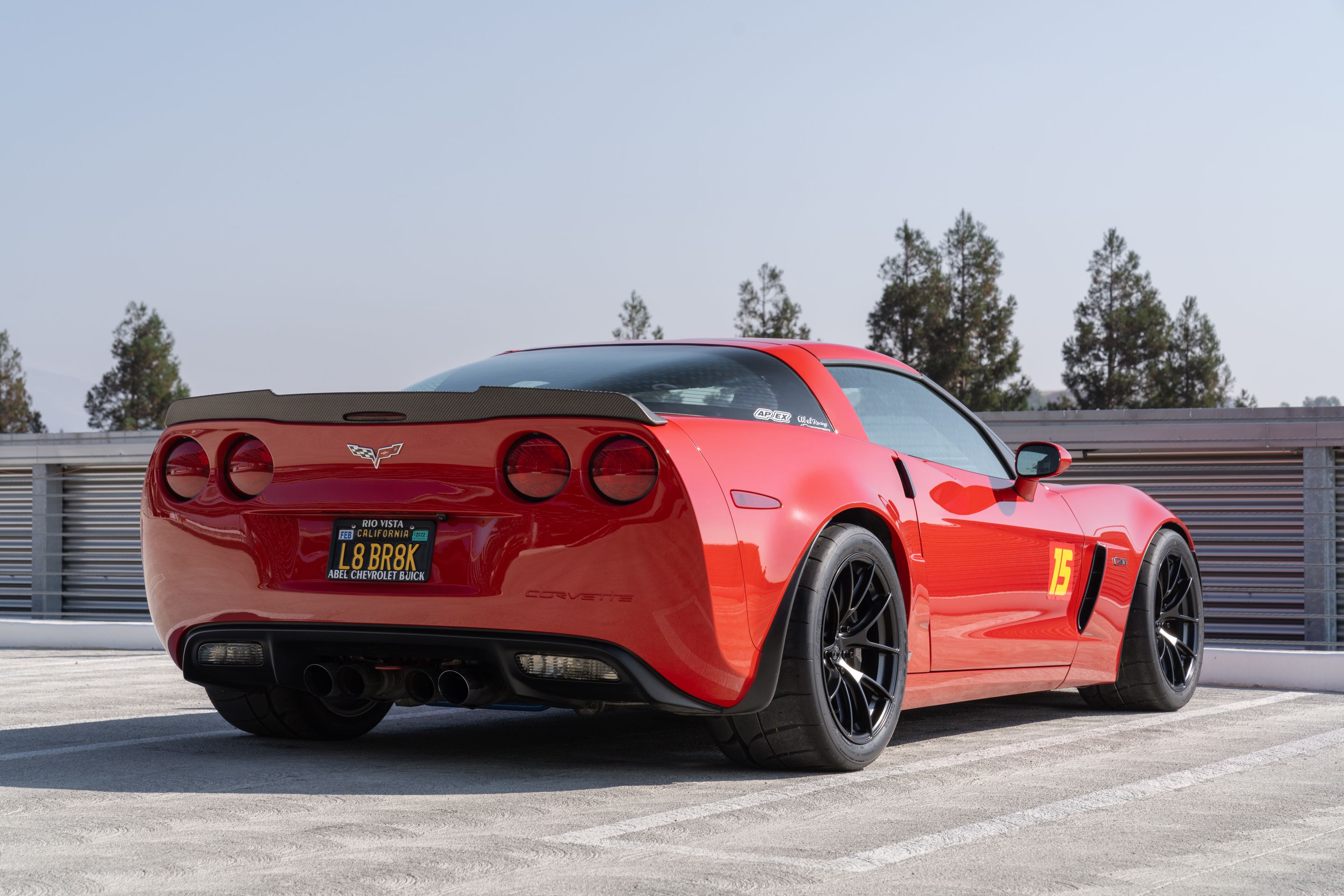 Red Chevrolet C6 Corvette Z06 with 18" VS-5RS Apex wheels in Satin Black