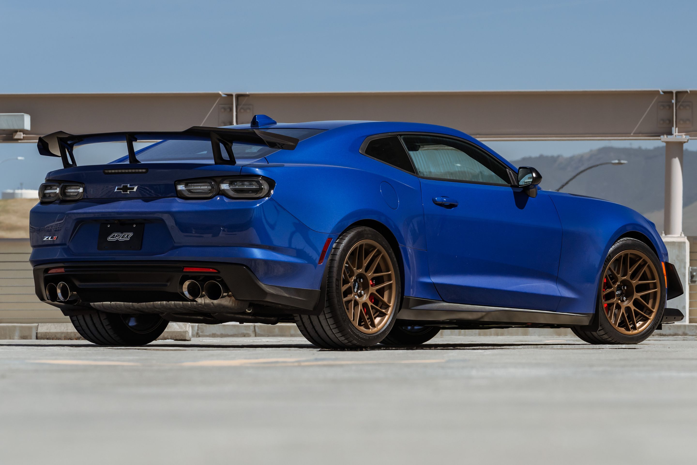Blue Chevrolet 6th Gen Camaro ZL1 1LE with 19" ARC-8 Apex wheels in Satin Bronze