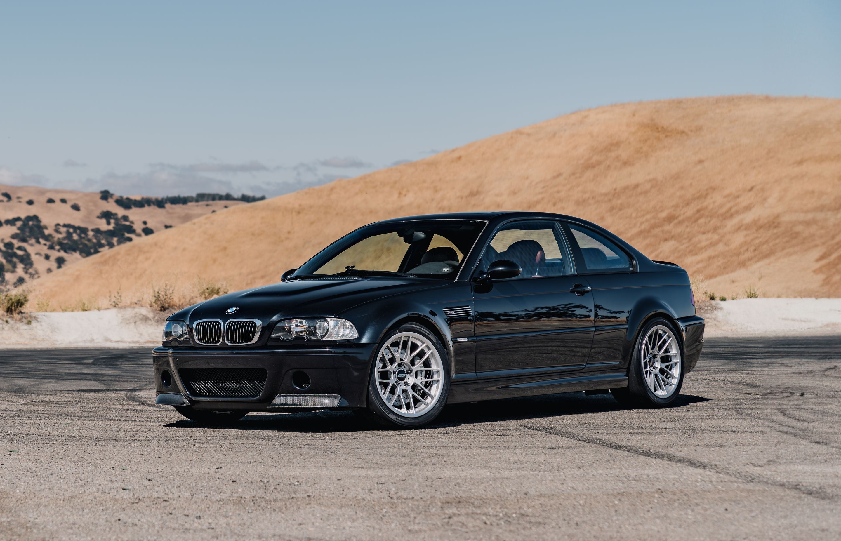 Black BMW E46 M3 with 18" ARC-8RT Apex wheels in Race Silver