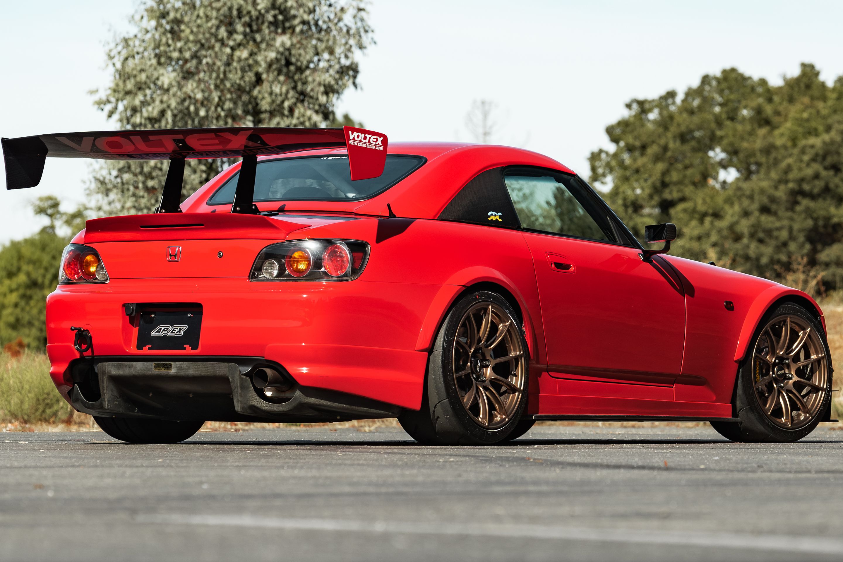 Red Honda S2000 with 18" SM-10RS Apex wheels in Satin Bronze