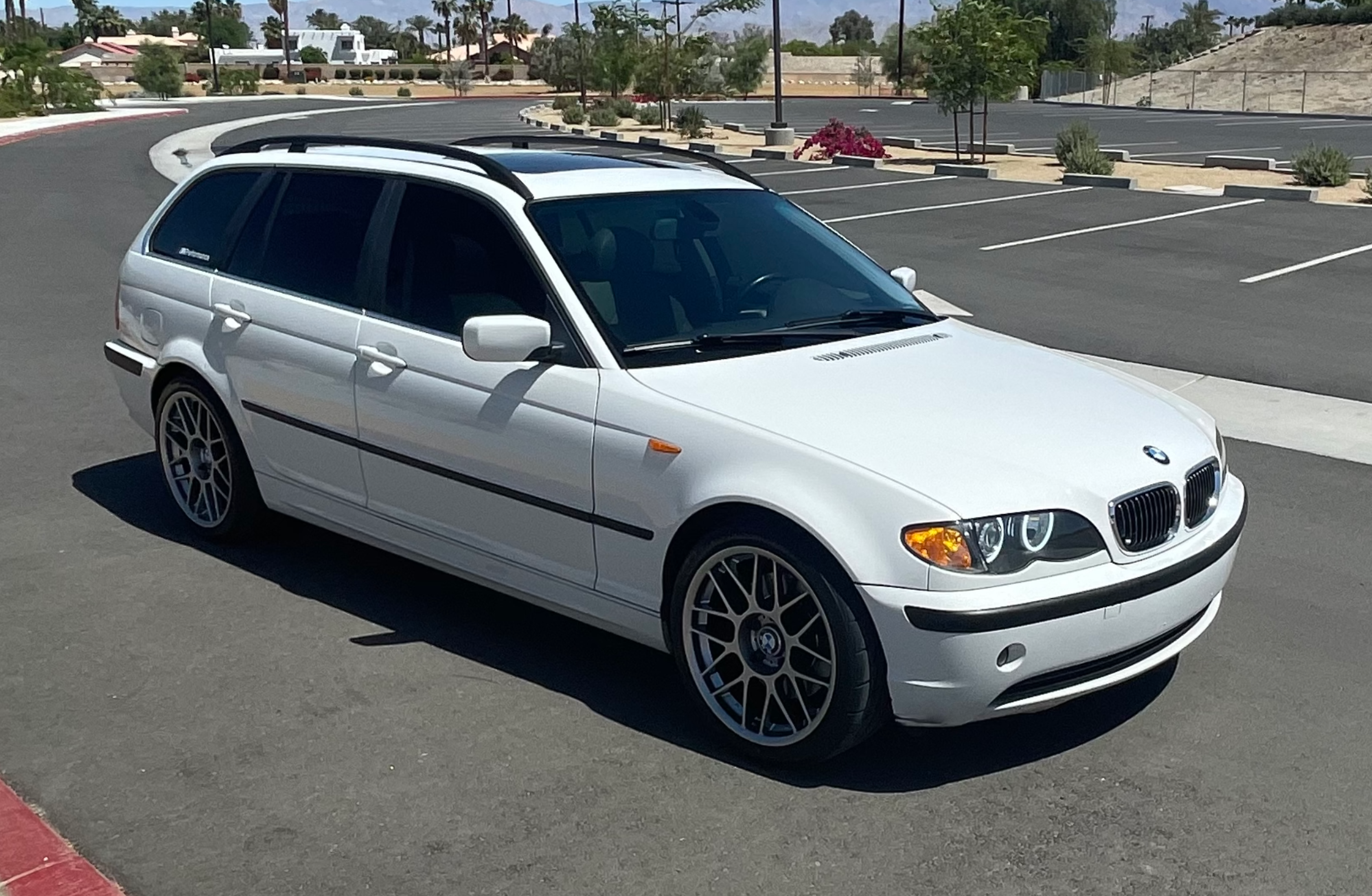 White BMW E46 3 Series with 18" ARC-8 Apex wheels in Hyper Black