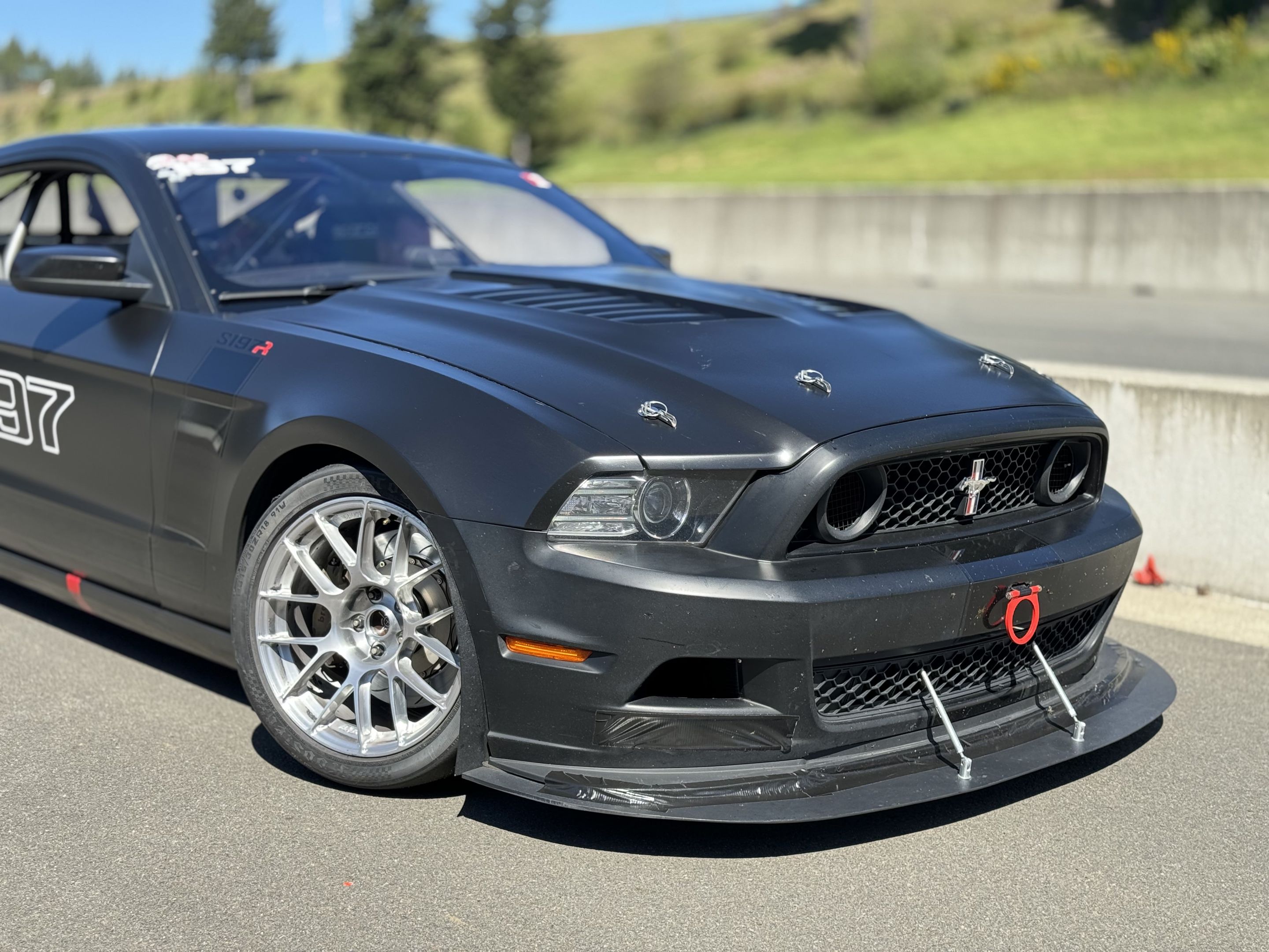 Black Ford S197 Mustang GT with 18" EC-7RS Apex wheels in Brushed Clear