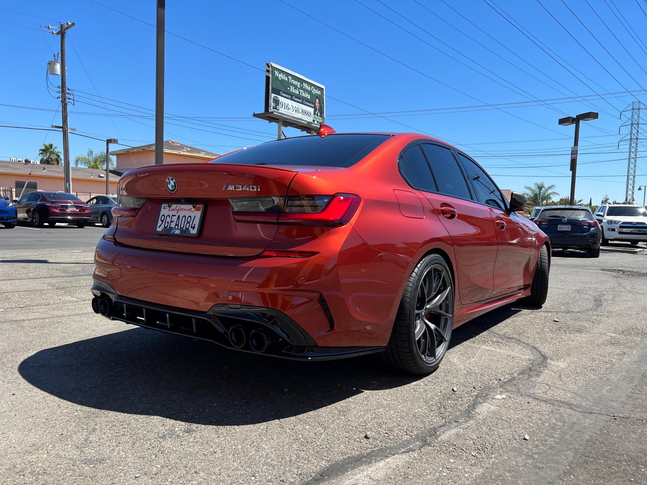 Orange BMW G20 Sedan 3 Series with 19" VS-5RS Apex wheels in Anthracite