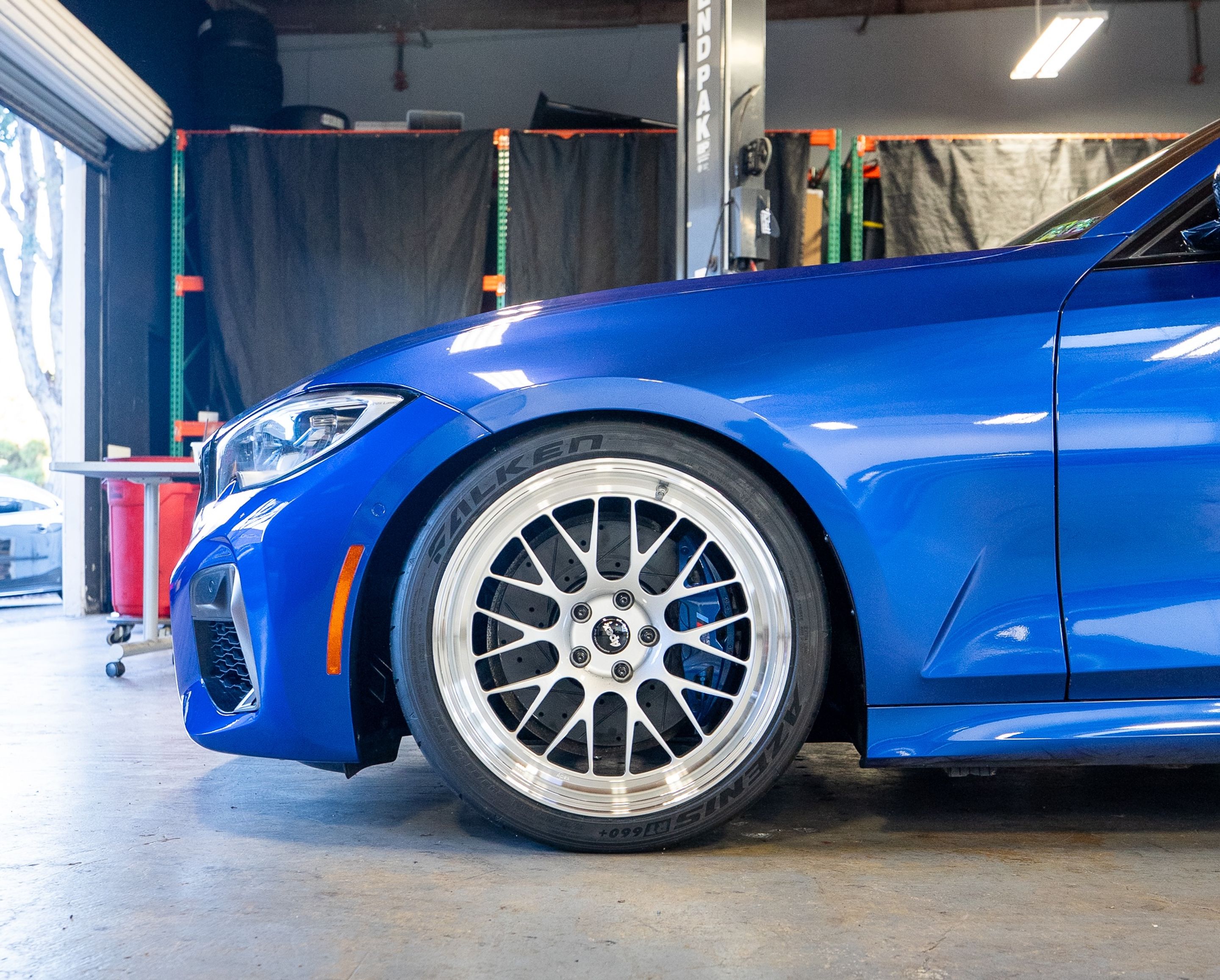 Blue BMW G20 Sedan 3 Series with 19" ML-10RT Apex wheels in Machined Lip Race Silver