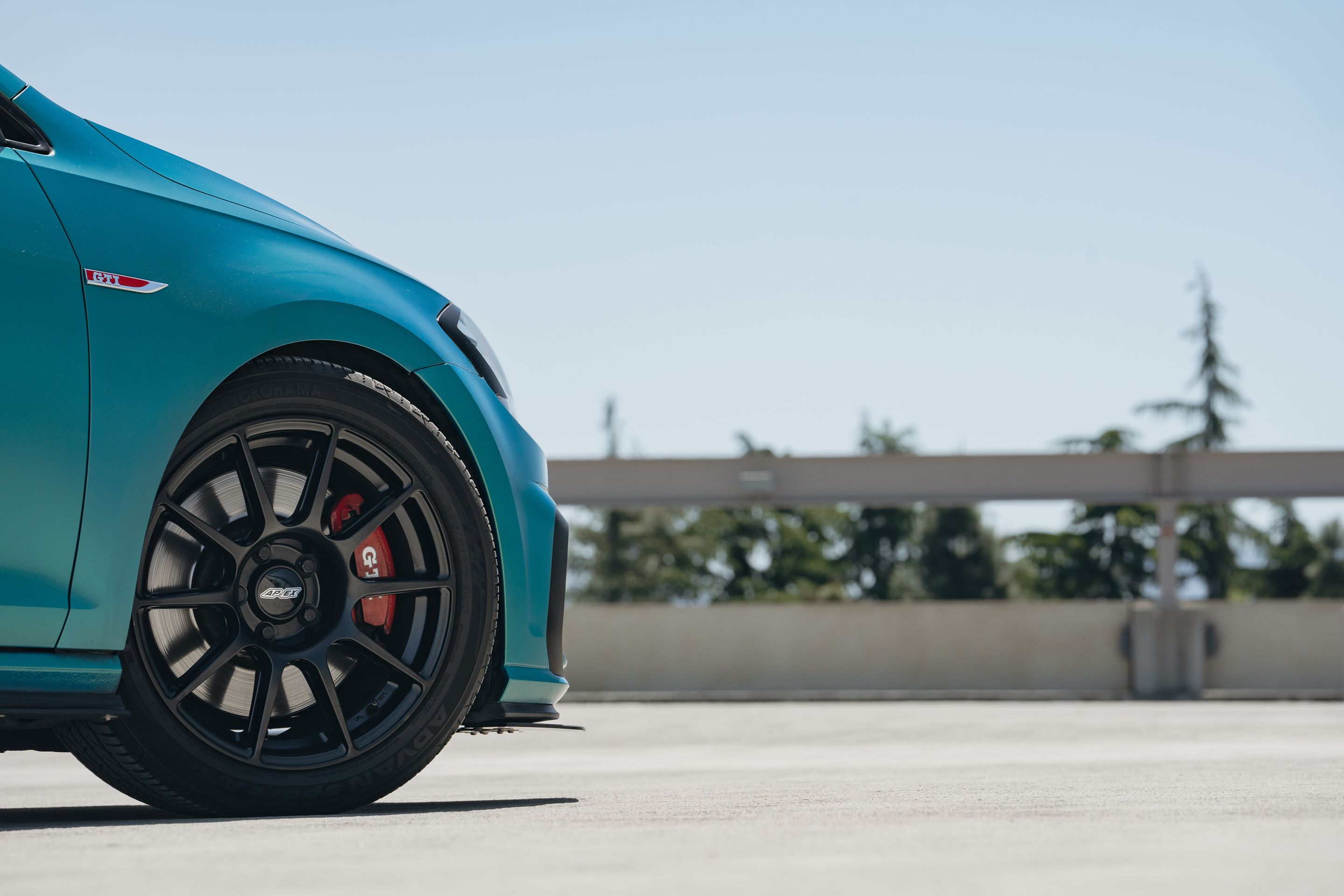 Green VW MK7 GTI with 17" SM-10 Apex wheels in Satin Black