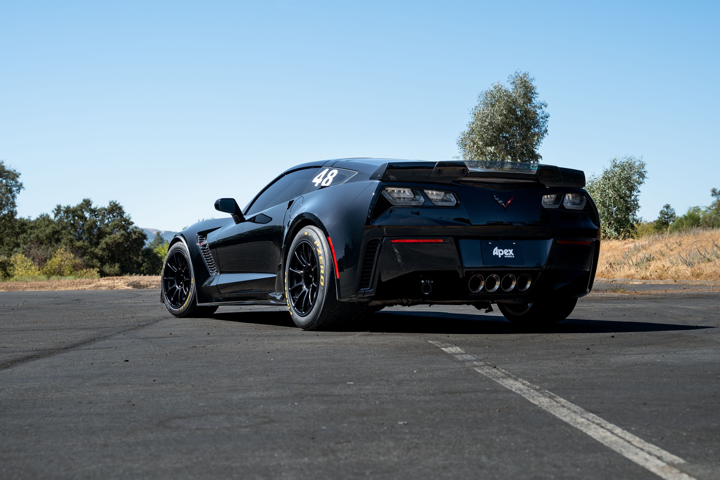 Black Chevrolet C7 Corvette Z06 with 18" SM-10RE Apex wheels in Satin Black