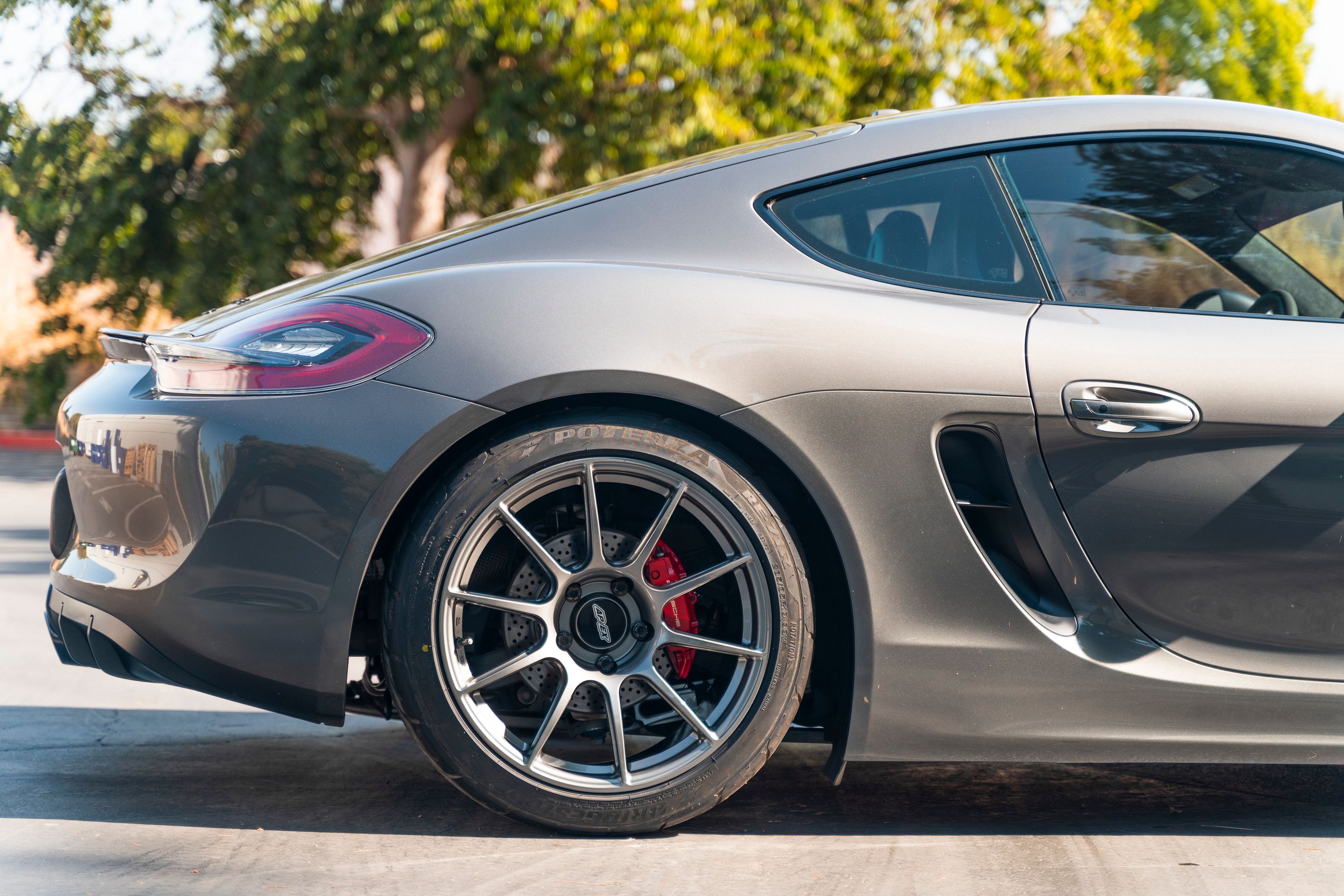 Grey Porsche 981 Cayman GTS with 19" SM-10 Apex wheels in Anthracite
