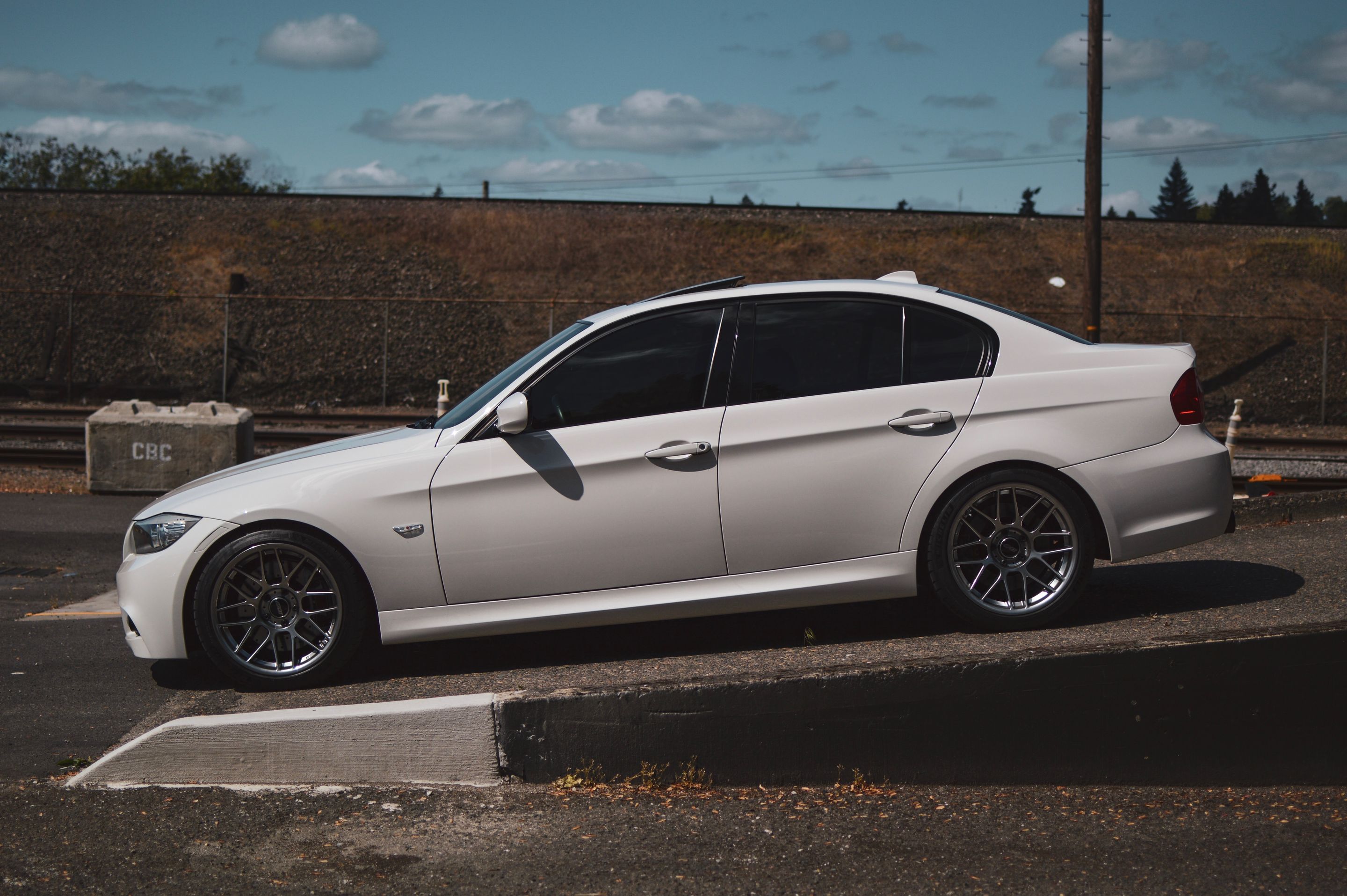 White BMW E90 LCI Sedan 3 Series with 18" ARC-8 Apex wheels in Hyper Black