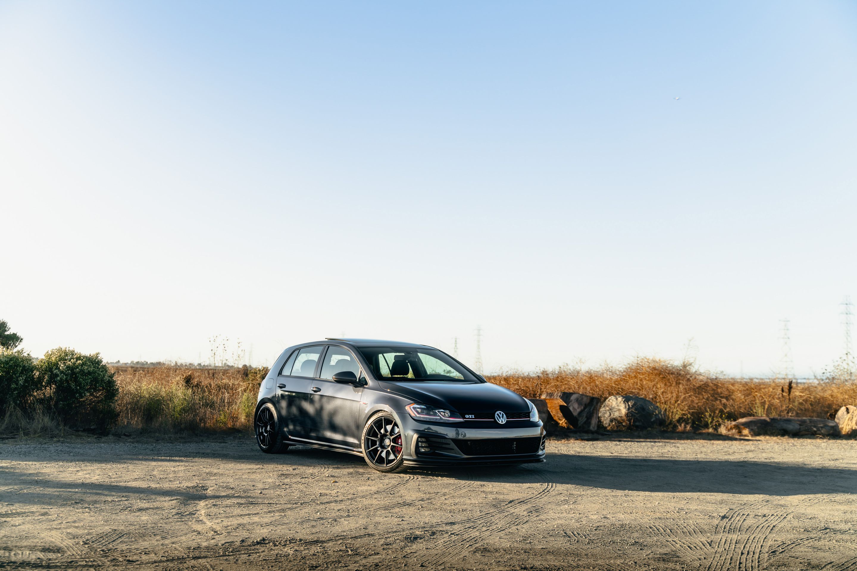 Grey VW MK7 GTI with 18" SM-10 Apex wheels in Satin Black