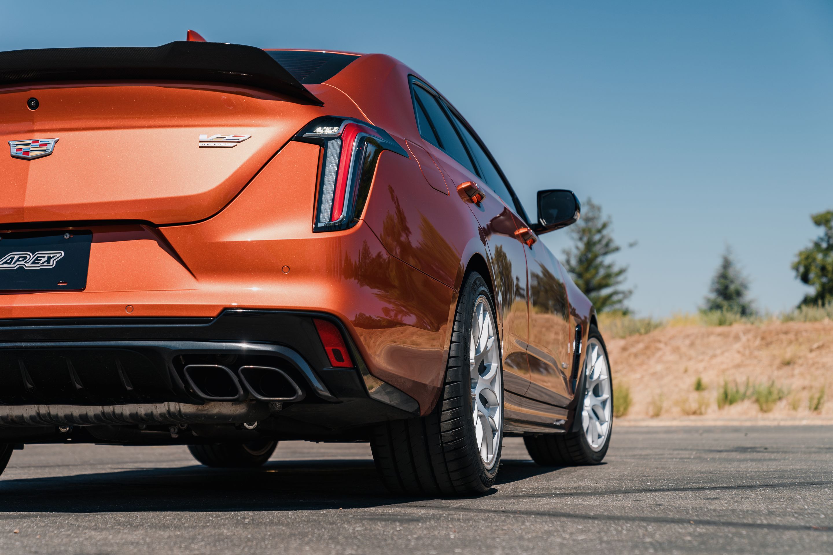 Orange Cadillac CT4-V Blackwing with 18" EC-7 Apex wheels in Race Silver