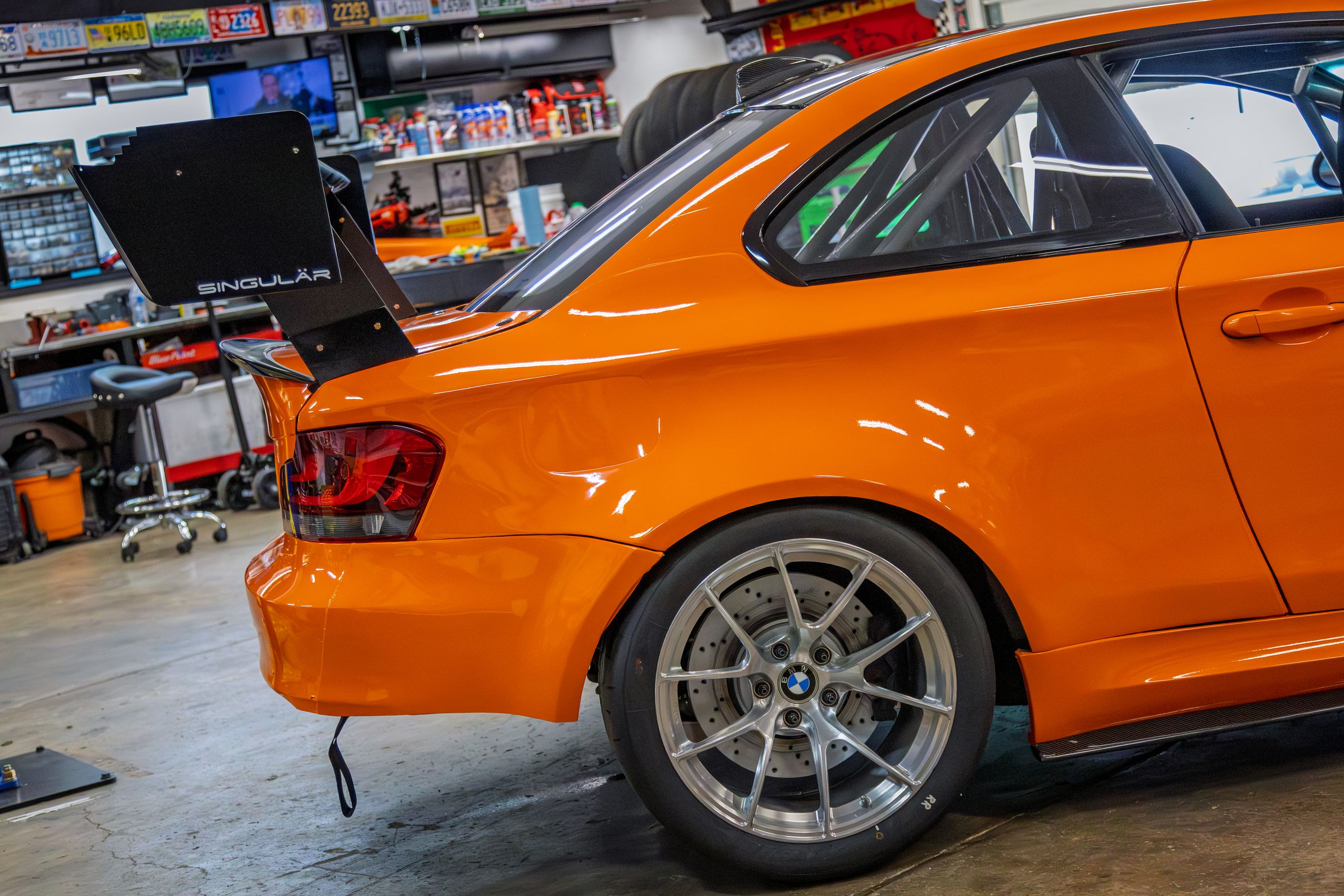 Orange BMW E82 1M with 18" VS-5RS Apex wheels in Brushed Clear