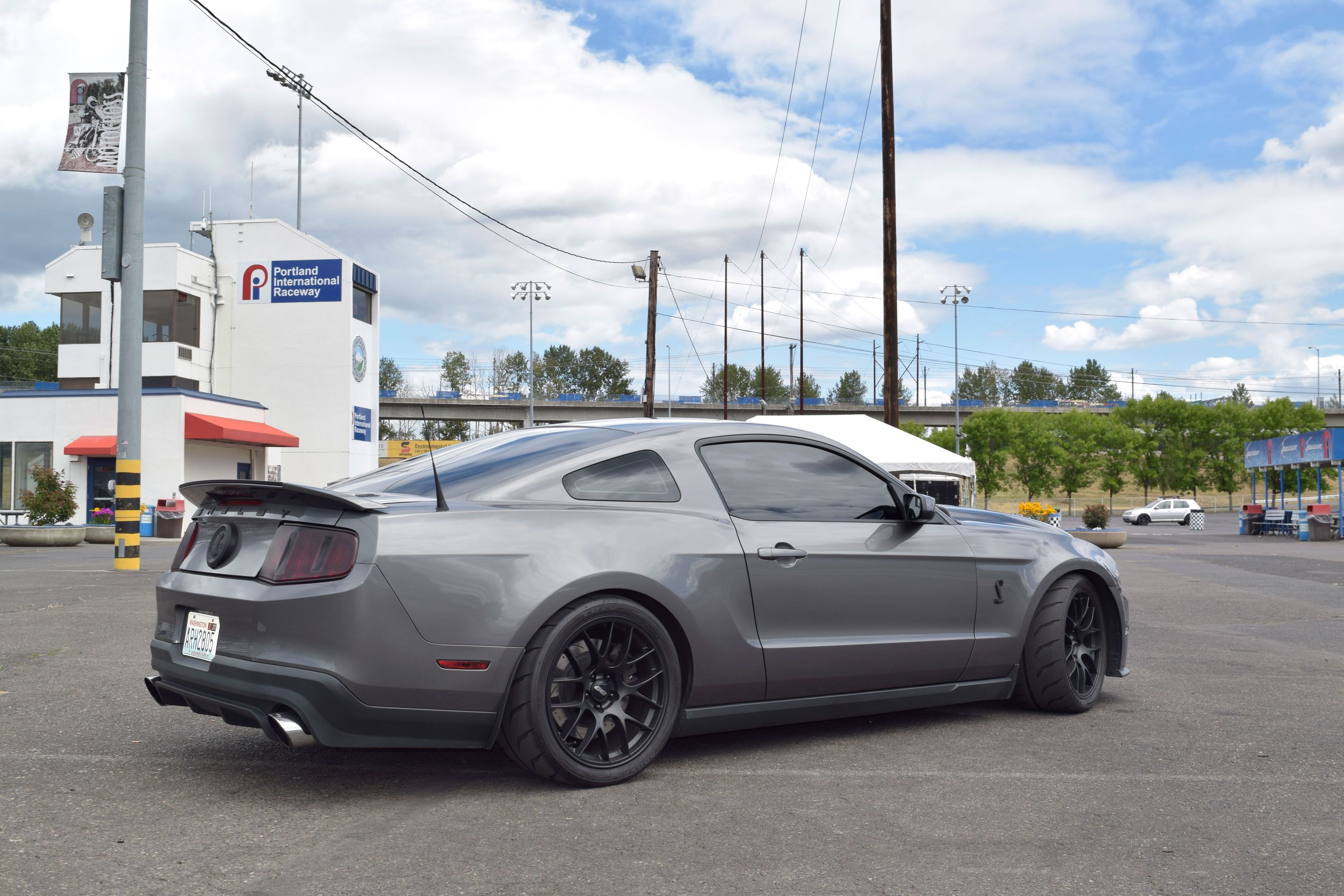 Grey Ford S197 Mustang GT500 with 19" EC-7 Apex wheels in Satin Black