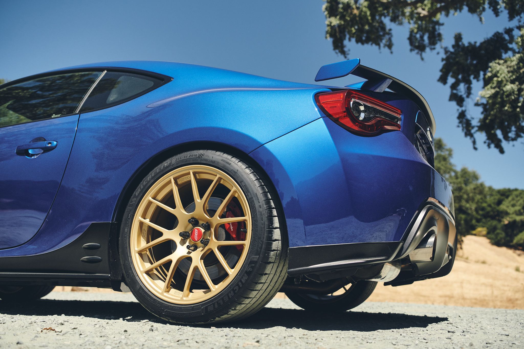 Blue Subaru ZC6 / Gen 1 BRZ with 17" EC-7R Apex wheels in Satin Gold