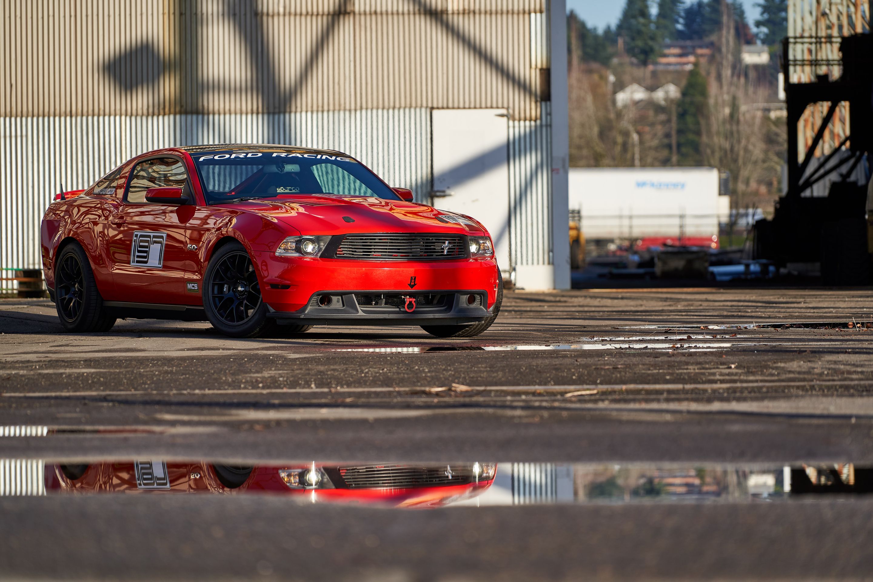Red Ford S197 Mustang GT with 18" EC-7 Apex wheels in Satin Black