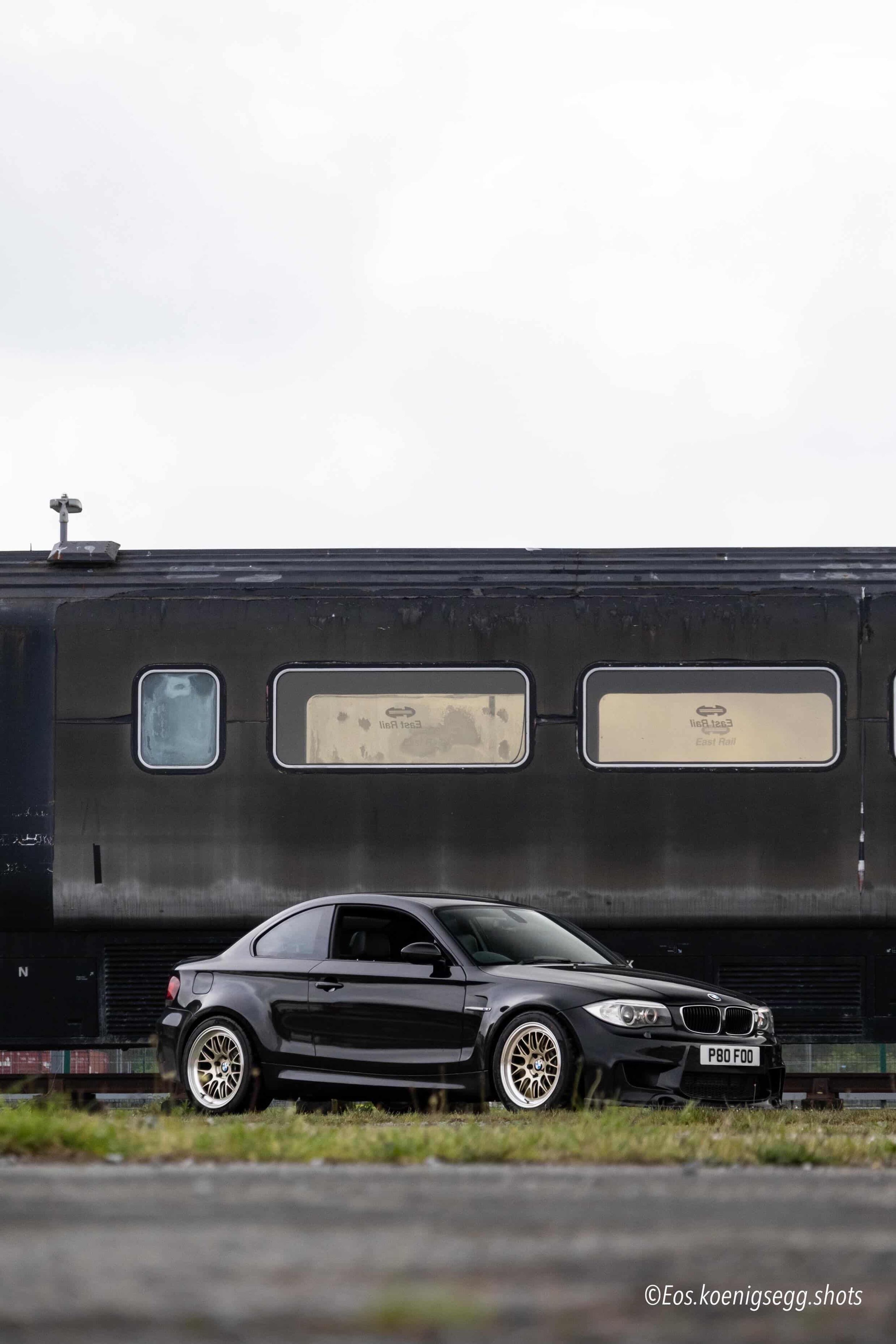 Black BMW E82 1M with 18" ML-10RT Apex wheels in Machined Lip Gloss Motorsport Gold