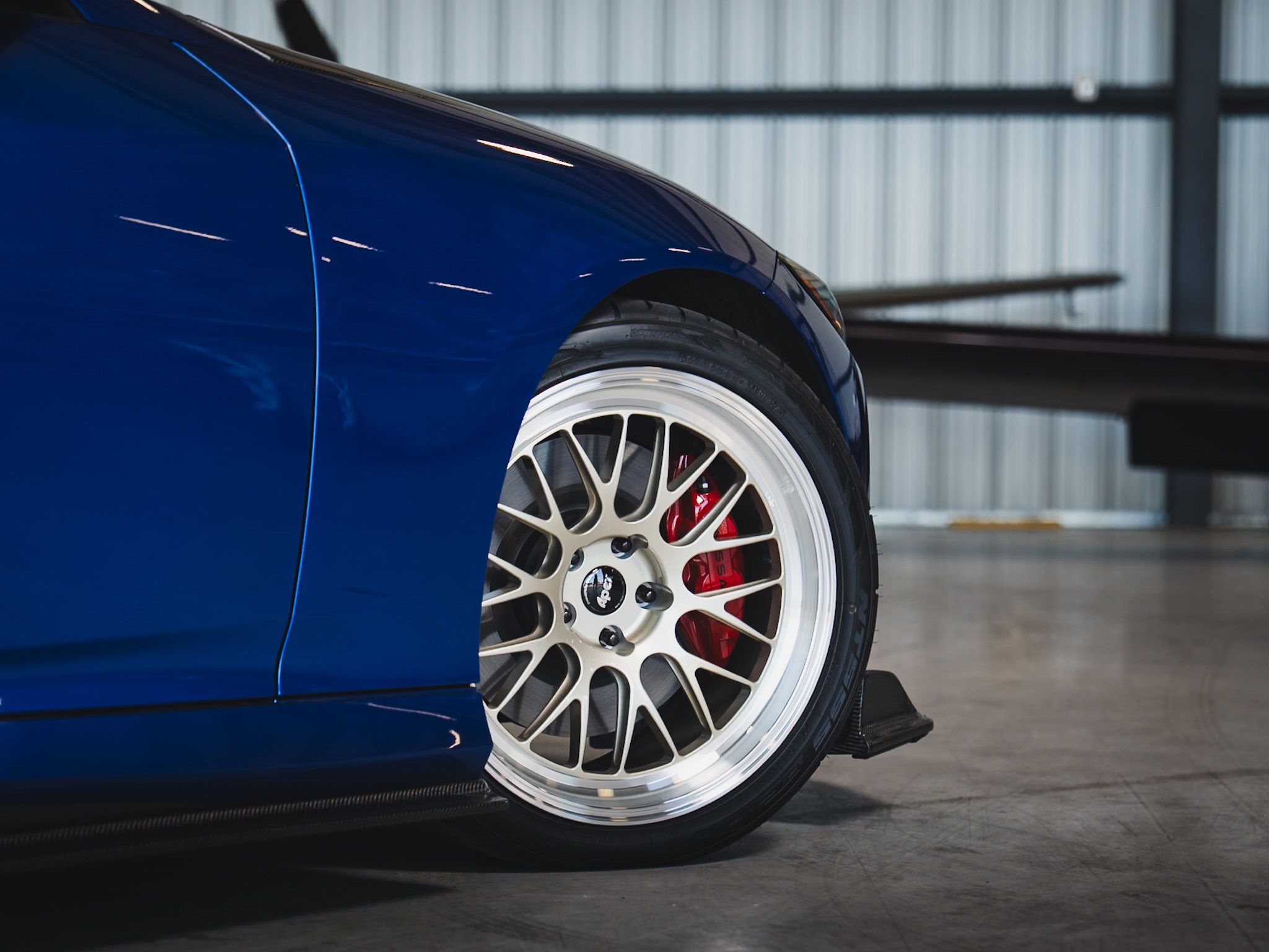 Blue Nissan Z with 19" ML-10RT Apex wheels in Machined Lip Gloss Motorsport Gold