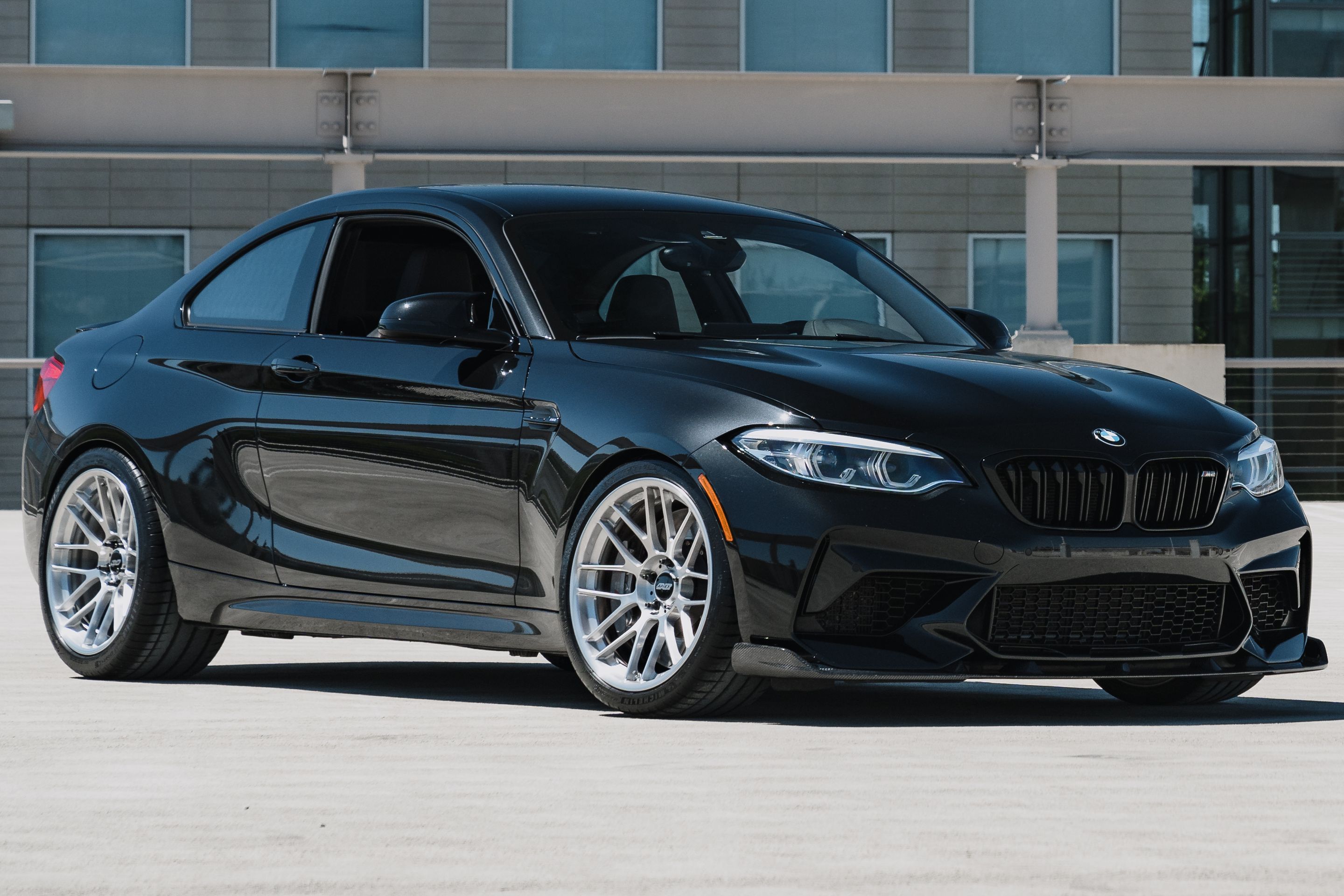 Black BMW F87 M2 with 19" ARC-8RT Apex wheels in Brushed Clear