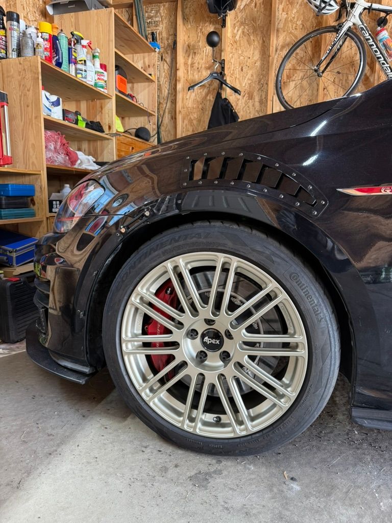 Black VW MK7 GTI with 18" TC-10RT Apex wheels in Motorsport Gold