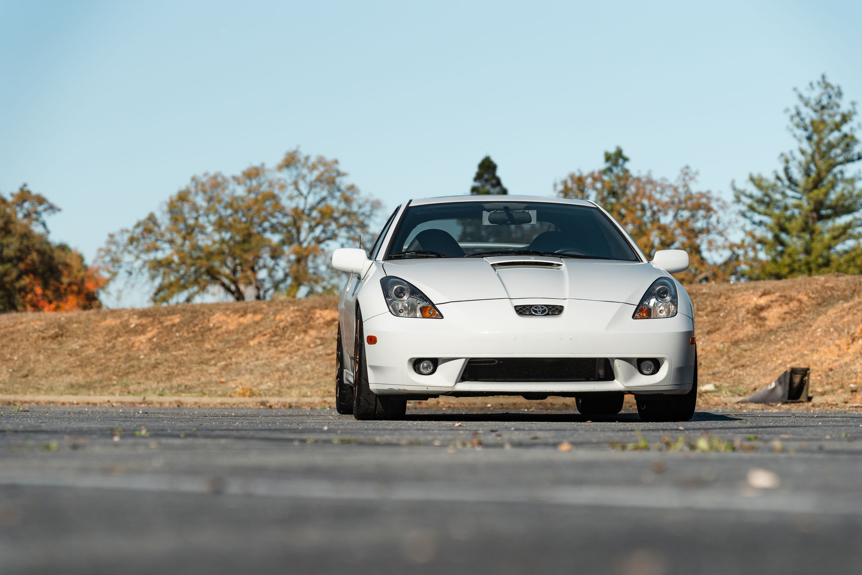 White Toyota 7th Gen Celica with 17" VS-5RS Apex wheels in Satin Bronze