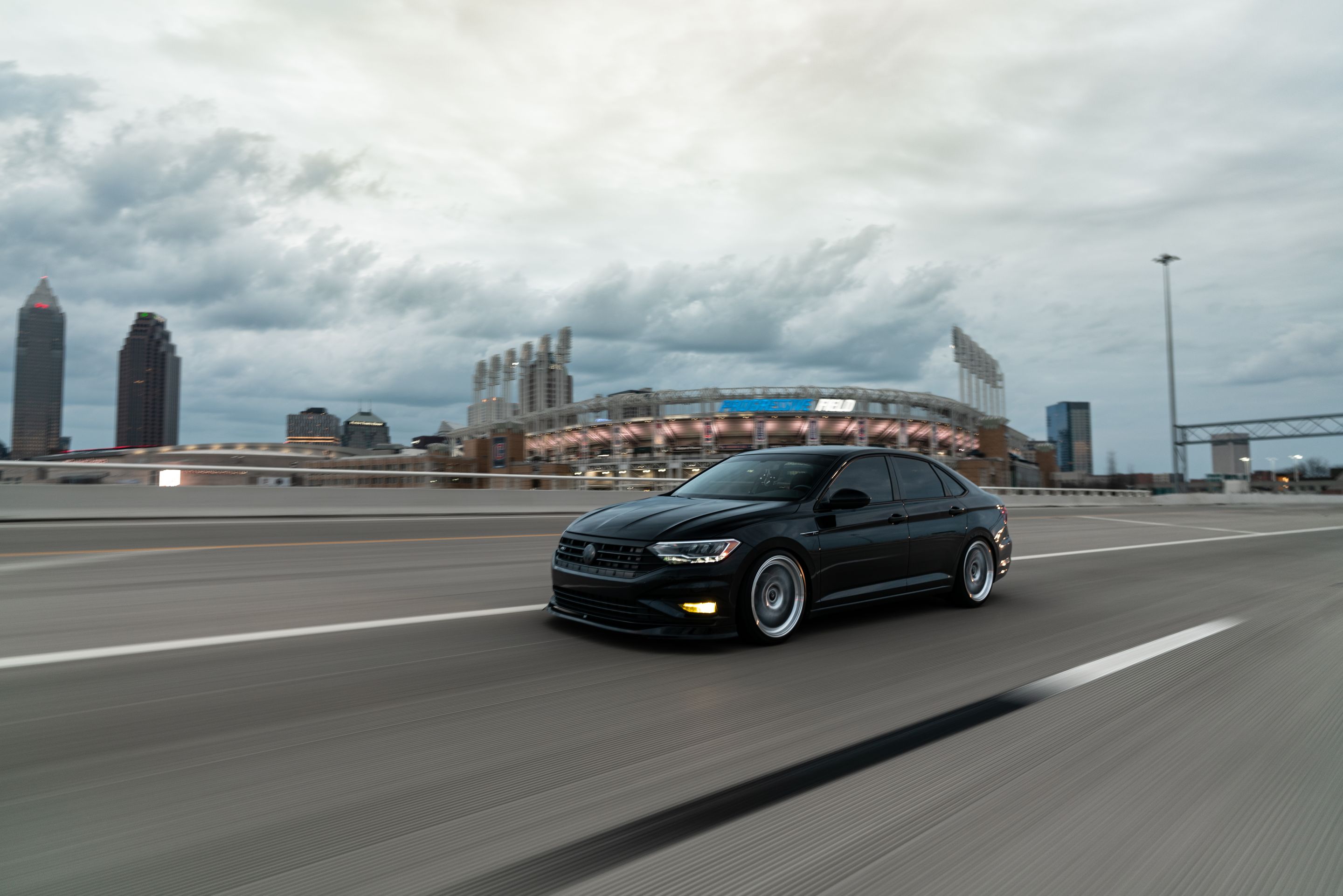 Black VW MK7 Jetta with 19" ML-10RT Apex wheels in Machined Lip Race Silver