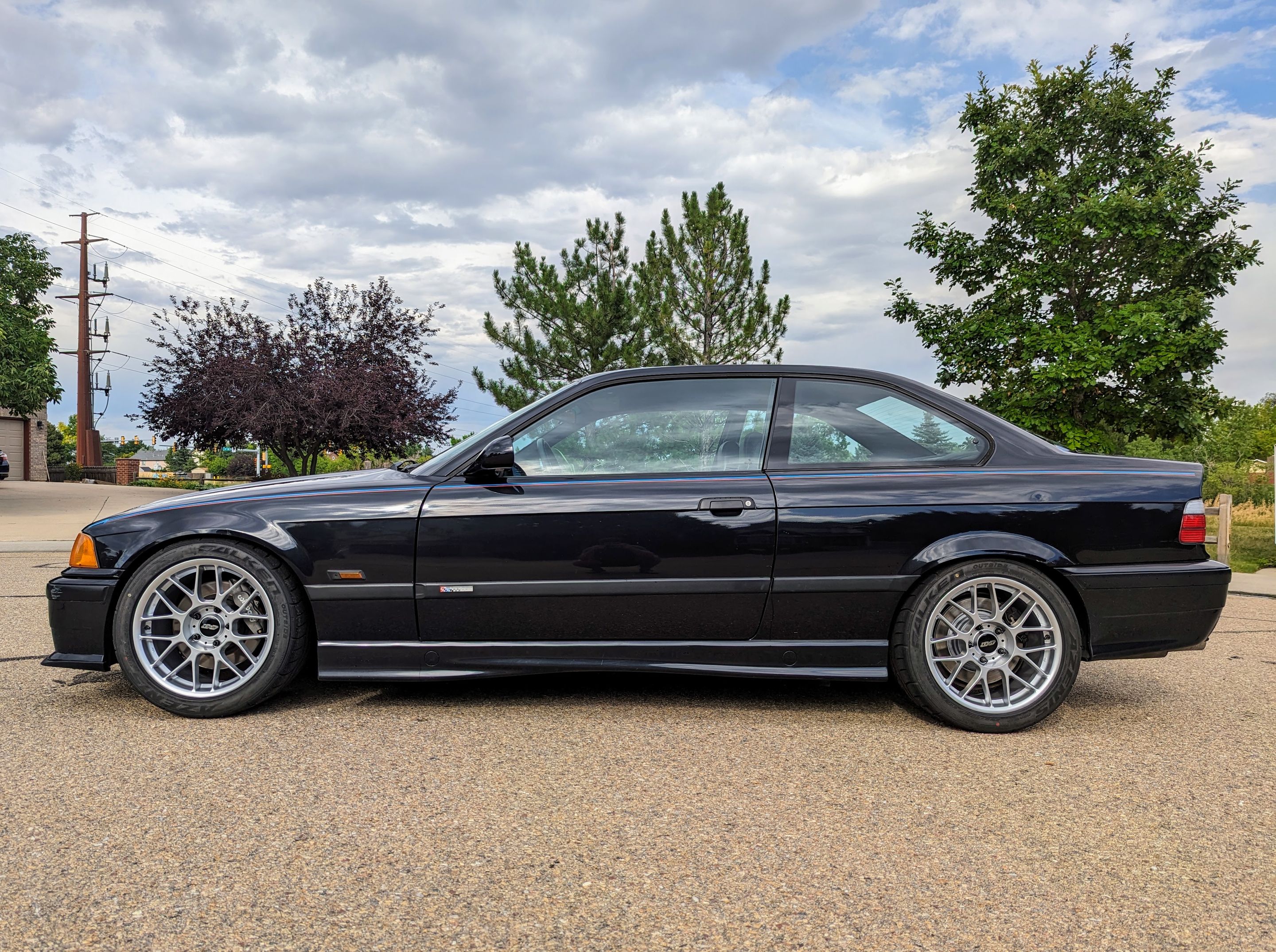 Black BMW E36 M3 with 17" ARC-8 Apex wheels in Hyper Silver